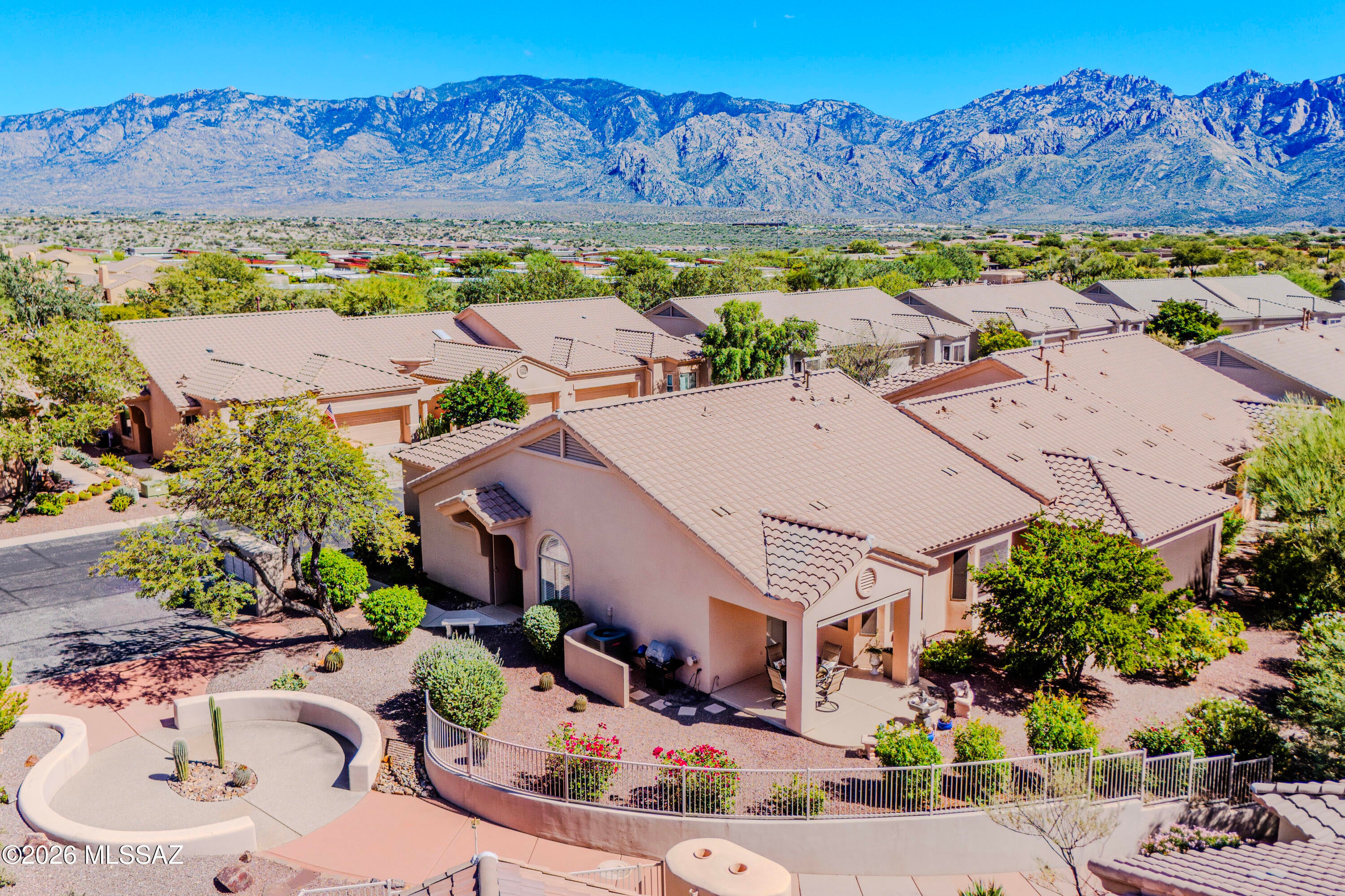 Welcome to Vistoso Village in desireable Oro Valley, Arizona! This updated 2 bedroom, 2 bath townhome features a split bedroom floorplan, remodeled kitchen with newer appliances and a comfortable living space perfect for everyday living and entertaining. The home was freshly painted within the last couple of years and features a new roof for added peace of mind. The 2-car garage offers excellent storage. Enjoy low maintenance living with the community covering the roof, exterior paint, pest control, internet and water. Close to shopping, dining, golf, recreation and the Catalina Mountains. Community amenities include pool, spa, exercise, clubhouse and more. A wonderful opportunity to enjoy the best of the Oro Valley lifestyle!
