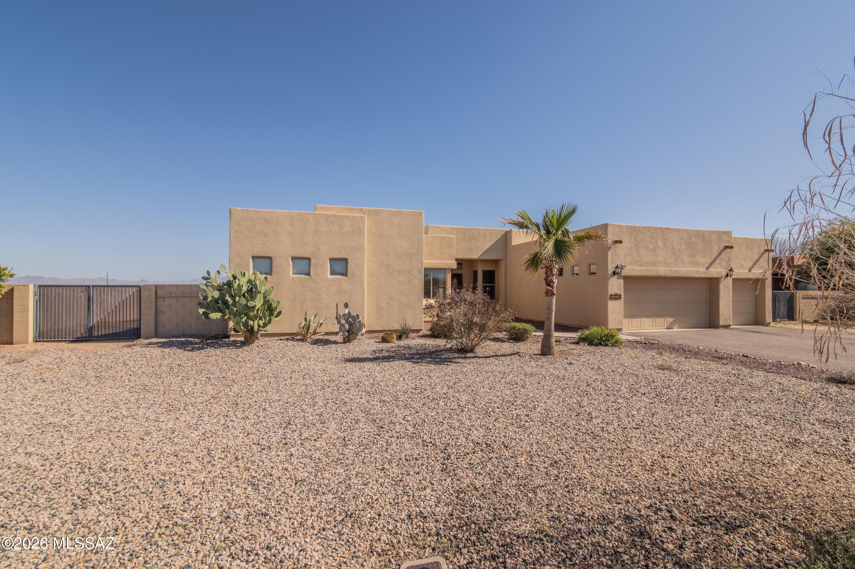Looking for space and tranquility? You'll find both on this spacious 0.86 acre lot in Avra Valley. Enjoy the heated Pebble-Tec saltwater pool with nearby gazebo surrounded by pavers. Perfect for entertaining and summer fun. An expansive wrap around Arizona room adds the perfect place to relax and unwind. The home features soaring ceilings, a gas fireplace, and an extra large master suite along with three well proportioned secondary bedrooms. In addition there is a generous size bonus room that can be used as a media room, office or guest suite. Ideal for hosting those winter visitors. Additional amenities include zoned heating/cooling, a third bathroom, a spacious master bathroom with jetted tub, and  abundant closet and storage space to meet all your needs.