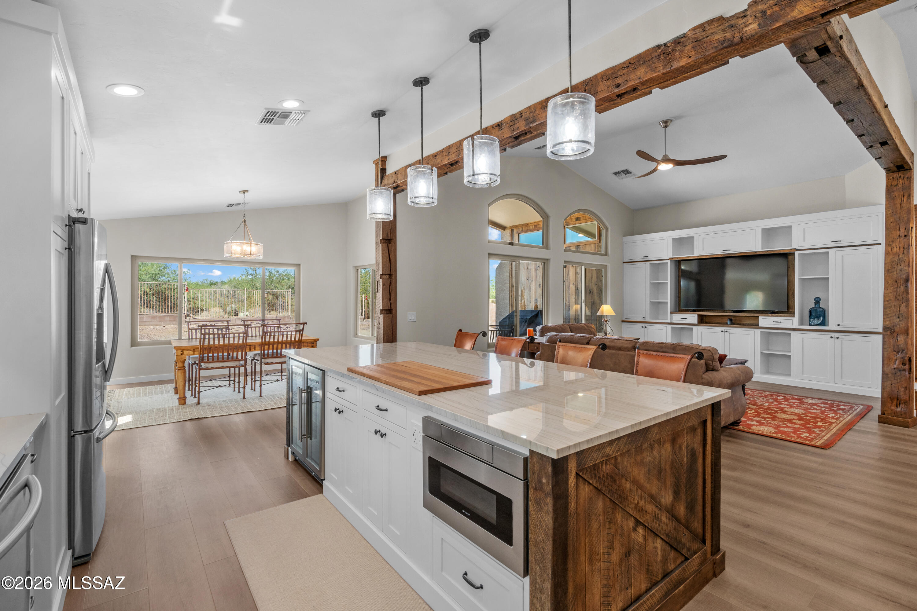 Gorgeously renovated custom interior. White Oak accent wood and beams reclaimed from a barn built in 1892! Cul-de-sac lot with no neighbors in front or behind. 4 bedrooms and 2 bathrooms. Quartzite stone counters in the kitchen plus dovetail, soft-close cabinets. Luxury vinyl plank throughout, no carpet. Vaulted ceilings. The back-lit mesquite slabs in the niches will stay with the home. New windows throughout. The garage has epoxy flooring and storage cabinets. Updated A/C (2023). Check out the community park and pool.