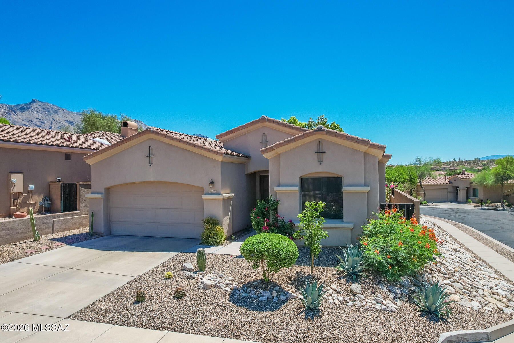Welcome home to this exceptional 4-bed 2-bath residence in the prestigious La Paloma. Situated in the heart of the Catalina Foothills, this home offers spacious living, picturesque desert surroundings, and easy access to world-class golf, shopping, dining, and outdoor recreation, thoughtfully designed for both everyday living, and entertaining, the home features bright, open living spaces, and a corner lot ideal for enjoying Tucson's beautiful weather. Residents also enjoy access to a sparkling community pool. Experience resort style living in one of the Foothills' most sought after communities. This home just got a NEW ROOF completed August 2026 with a 5 year transferrable warranty to next owner!!