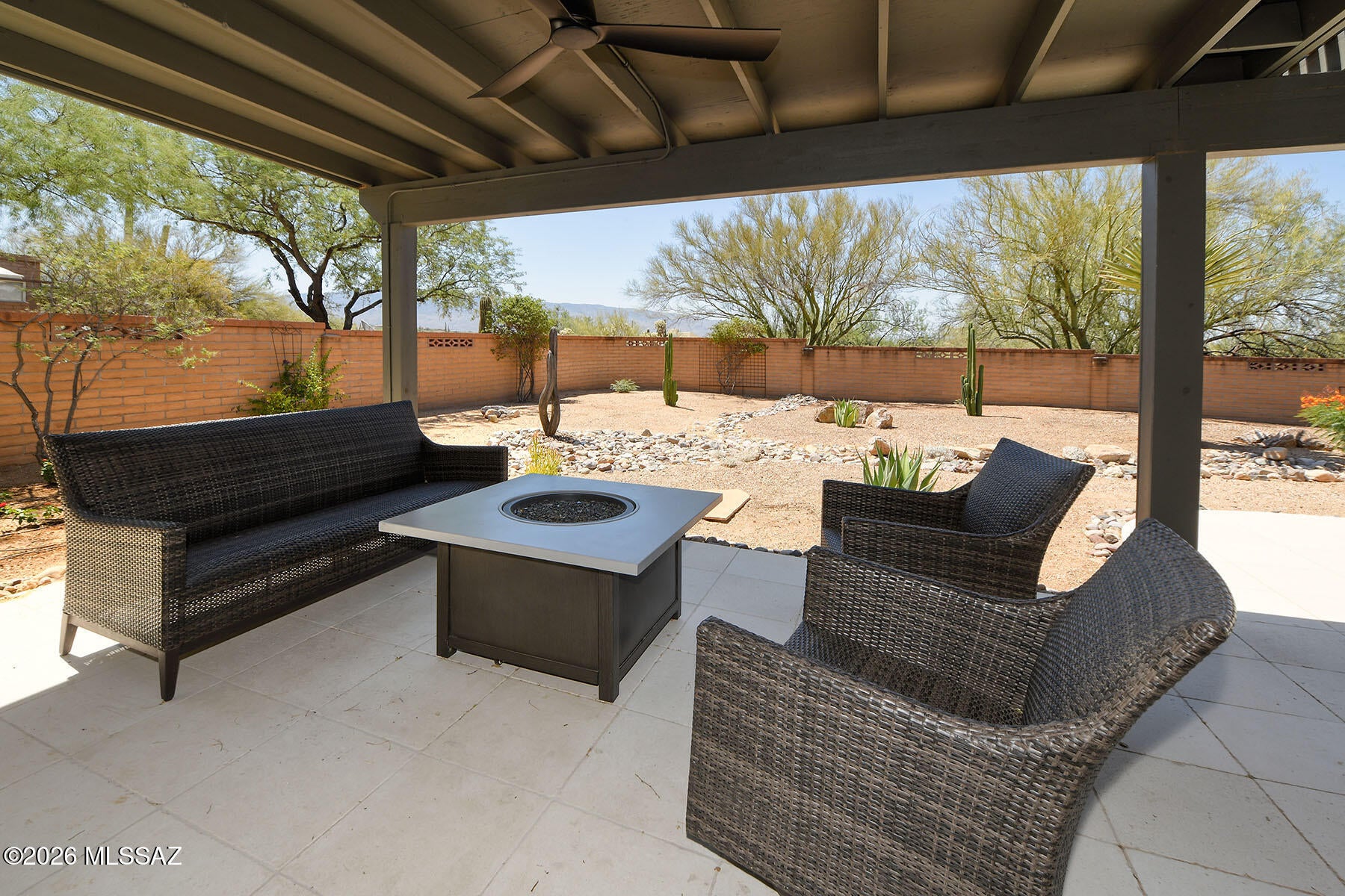 Nestled in the heart of the Tanque Verde Valley, this beautifully remodeled, with over $200K in upgrades, 1,834 sq. ft. home sits on 1.17 acres with spectacular mountain views from both front & back. Updated within the last 3 years, this move-in-ready property offers 3 bedrooms, 2 baths, a spacious living room with built-ins, gas fireplace, and elegant finishes throughout. The stunning kitchen features quartz waterfall countertops, custom shaker cabinets, stainless appliances, wine fridge, farmhouse sink, and custom backsplash. Enjoy an expansive covered patio, new pergola, renovated spa, and low-maintenance landscaping with drip irrigation. Located in the highly rated Tanque Verde School District, close to parks and hiking trails, this exceptional home combines privacy, style, and comfort THE PROPERTY
" Ideally located in the Tanque Verde Valley 
" Spectacular Mountain Views from both Front & Back  
" 1.17-acre property with Enclosed Backyard; masonry wall & beautifully designed custom 
metal gates 
" New Tile on Front Porch 
" Renovated backyard - New pergola, patio tile, landscaping, & updated in-ground spa  
" Extended Covered Patio, & Beautiful Low-Maintenance Vegetation with drip irrigation  
" 2-Car Garage with storage shelves 
" Laundry room off kitchen 
" Salt-based water softener system for entire home 
" Top-rated Tanque Verde School District  
" Close to Aqua Caliente Park, Hiking Trails & More! 
THE HOME 
" 1,834 square feet 
" Stunning remodel completed within the last 3 years - move-in ready with high-end 
finishes and polished details 
" 3 Spacious Bedrooms & 2 full baths 
" Large Living Room with Built-in shelves and lighting 
" Gas Fireplace with batten board style surround 
" Large primary bedroom with ensuite and walk-in closet with custom organization system 
" Tile Flooring in Primary Bath 
" Subway tile on walls & in shower which features lipless entry for easy access 
" Hall bath is combined bath/shower combo with extra deep tub, styled with white picket 
tiles and blue/green accents 
" Wide sliding doors in Kitchen, living room and primary bedroom 
" Elegant lighting throughout the home including new remote -controlled ceiling fans 
IN THE KITCHEN 
" Beautifully remodeled kitchen in the last 3 years 
" Custom backsplash sets the kitchen apart with artisanal detail and finishes 
" Quartz countertops including island with waterfall edges 
" Custom shaker cabinets with pull out drawers 
" Stainless steel appliances and wine fridge 
" Reverse Osmosis System 
" Built-in desk and work area 
" Breakfast Bar, Casual Dining Area, and Formal Dining Room 
" Farmhouse Sink with touch water faucet 
" Large picture window