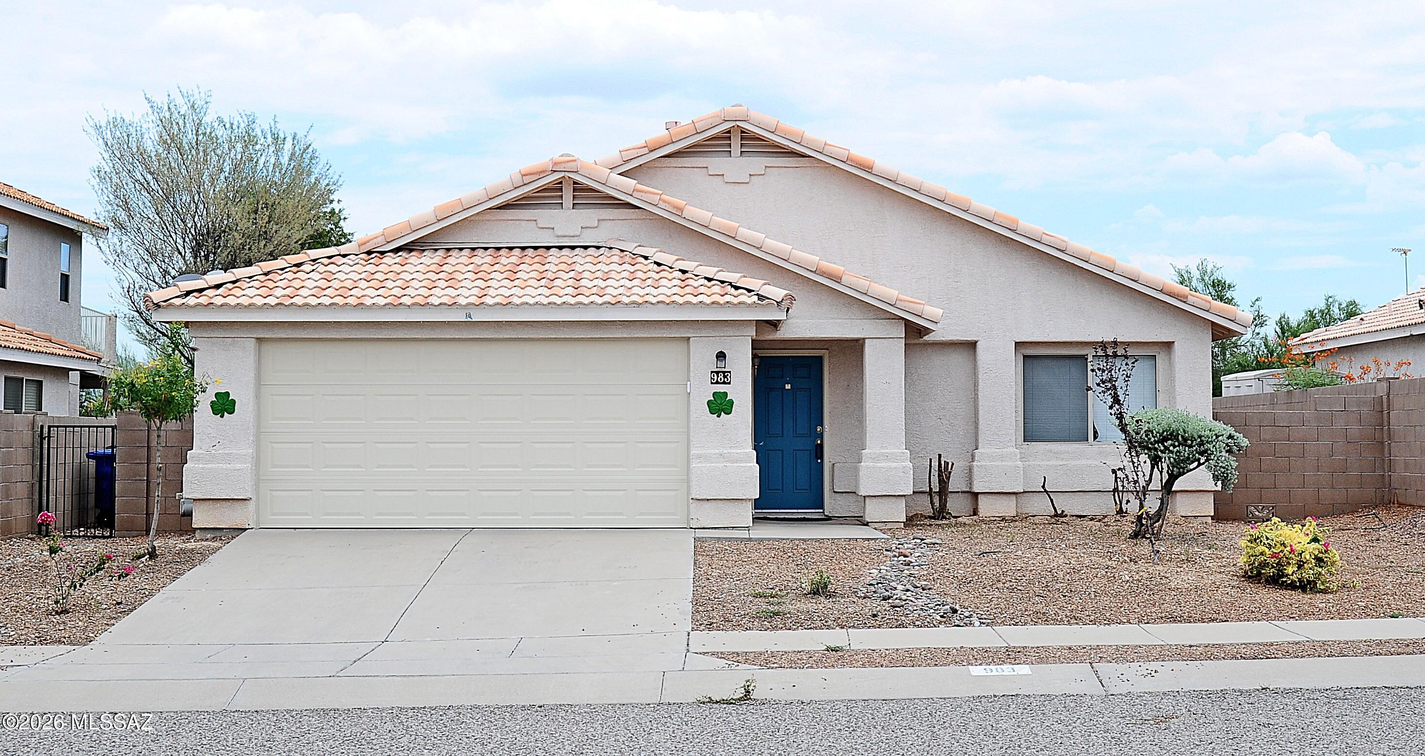 BACK ON MARKET WITH BRAND NEW ROOF,  FRESHLY PAINTED INTERIOR & EXTERIOR, NEW CARPET IN LVR & 2024 HVAC UNIT. This one owner 3 bed, 2-bath home located in the Mesquite Trails community is MOVE-IN READY! An open floor plan offers a comfortable living space with a kitchen that conveniently flows into the great room to enjoy conversations with the cook.  Vaulted ceilings create a bright, open feel, while a gas fireplace adds warmth and character to the living space. A spacious primary bedroom that allows a separate seating area and a walk-in closet. BRAND-NEW French doors open to an oversized, low-maintenance backyard featuring flagstone and MOUNTAIN VIEWS, a great space to relax, entertain, and enjoy the Tucson lifestyle. Conveniently located near shopping, restaurants, & everyday amenities
