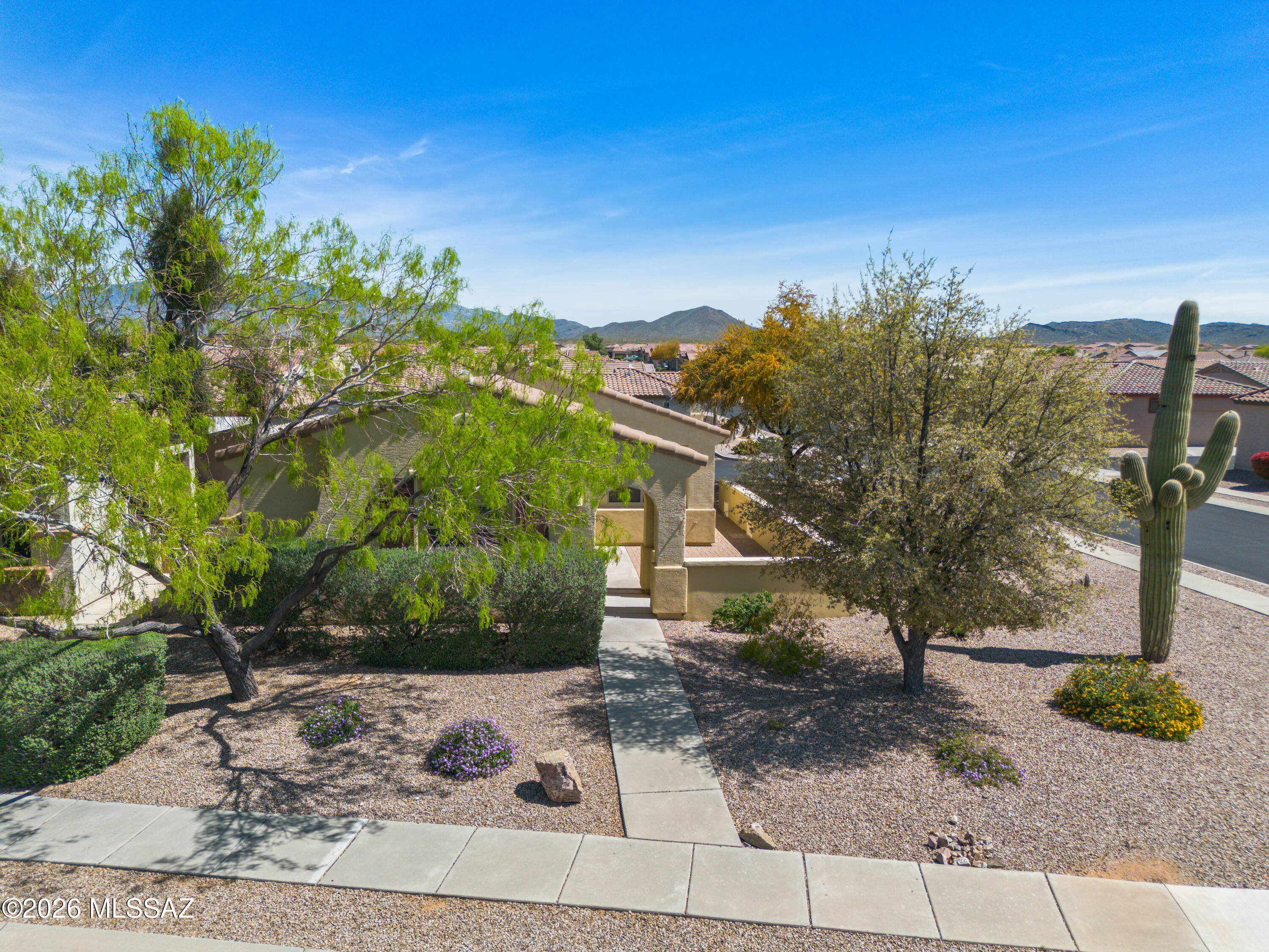 Location is everything! Located on a large corner lot w/convenient easy guest parking. This home features 2 bedrooms, 2 bath, split floor plan for privacy and separate additional DEN/OFFICE area. Kitchen offers Corian counter tops & white appliances giving clean seamless & trendy look. Enjoy the brightness from windows and calm neutral color palettes.  Del Webb offers full choices for daily lifestyle. Keep yourself busy w/exercise, pickleball, golf, swimming, crafts and club house amenities. Begin your morning sitting on front courtyard with coffee. Perfect home for the winter visitor or full-time sunshine enthusiast. If the Tucson Sunshine isn't enough to convince you, this beautiful 55+will seal the deal. Minutes away from Parks and shopping. Lush Common Grounds maintained by HOA.