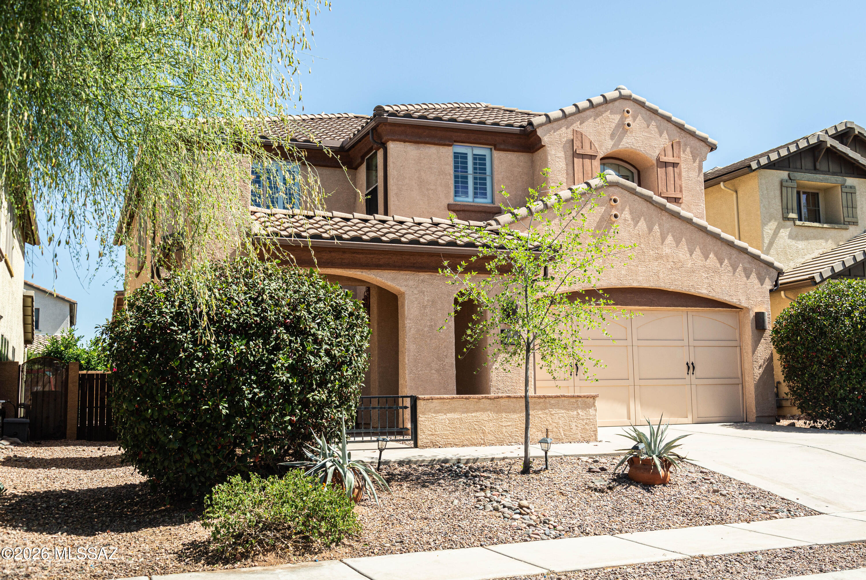 Explore this beautiful two-story residence offering 3,091 square feet of masterfully designed living space, featuring 4 spacious bedrooms and 2.5 bathrooms. From the moment you enter, a striking wrought-iron-and-wood staircase leads you into the open-plan living area, perfect for daily living and seamless entertaining. The gourmet kitchen boasts ample cabinet and counter space.
The absolute standout feature of this property is the professionally built, 200-square-foot bonus room. This versatile room offers the ultimate flexibility -all without sacrificing traditional bedrooms. Spanning a generous footprint, it is the perfect space for a quiet executive office, a private home gym, an expansive craft room, or a dynamic activity studio. Don't miss this unique Oro Valley gem! Stunning Two-Story Home with Premium Bonus Room!
Upstairs, a large, versatile loft offers excellent extra room for a media center, playroom, or secondary lounge. The primary suite serves as a private retreat with a separate tub and shower, while the second bathroom features dual vanities and a convenient tub/shower combo.