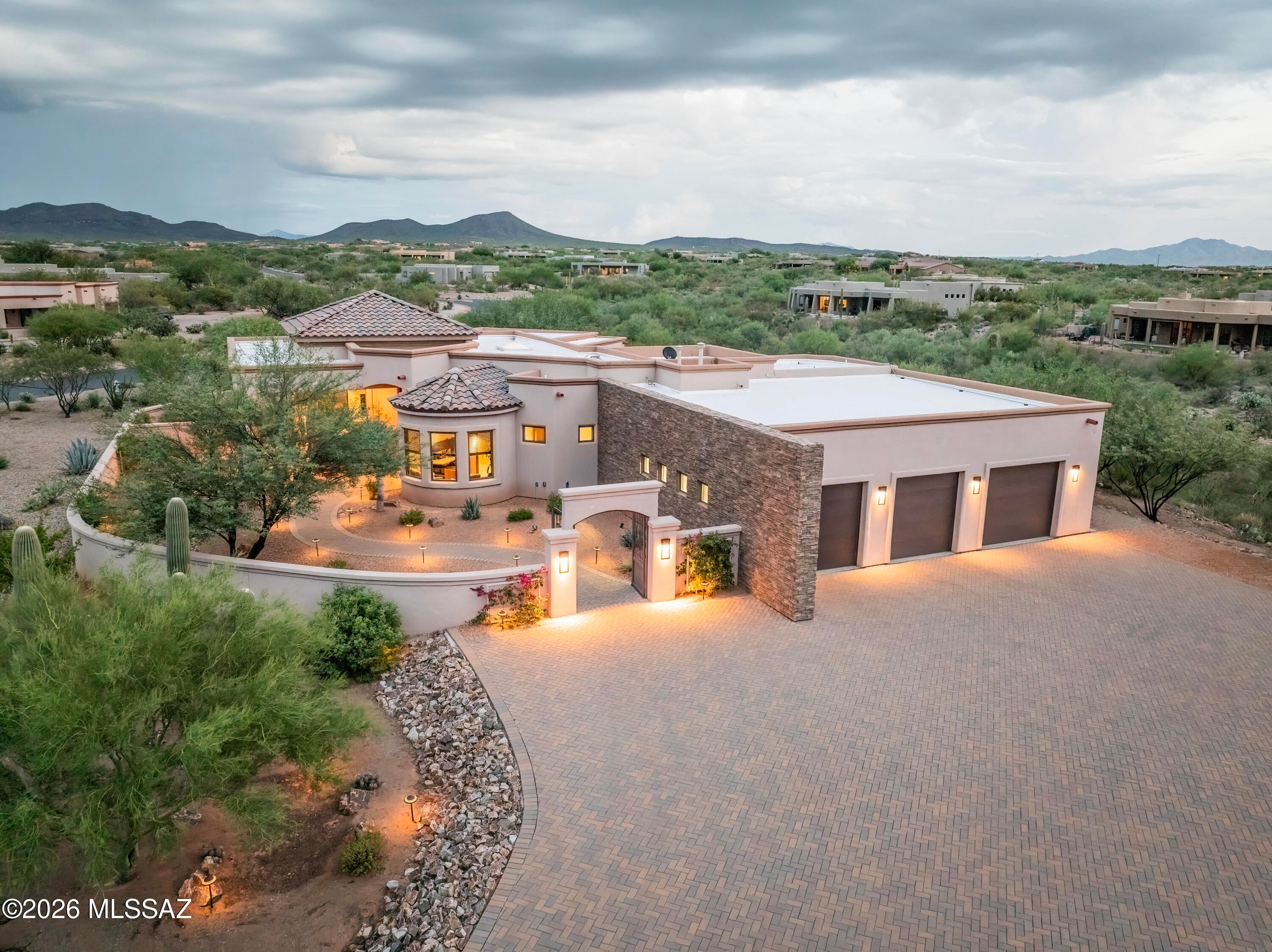 Wake up to Breathtaking Views and a lifestyle beyond compare......Prepare to be
captivated by this HOME. Perfectly positioned on 1.6 private acres within the prestigious gated community of Coyote Creek, this extraordinary custom estate was designed to showcase the breathtaking beauty of the Sonoran Desert. Spectacular mountain and
sunset views are framed from nearly every window, while oversized Pella windows fill
the home with natural light and seamlessly connect the elegant interiors to the stunning landscape beyond. A welcoming courtyard with custom iron gates and a striking handcrafted iron entry door creates an unforgettable first impression. Inside, timeless craftsmanship, refined finishes, and a thoughtfully designed split floor plan offer the perfect balance of sophistication, comfort, and privacy. Designed for effortless indoor-
outdoor living, multiple patios and entertaining spaces surround the home. Enjoy a sparkling pool, above-ground spa, tranquil garden retreat, lush artificial turf, and beautifully landscaped grounds--creating your own private desert resort. The luxurious
primary suite is a true sanctuary, featuring patio access, a spa-inspired bath with floor-to-ceiling porcelain tile, granite countertops, knotty alder cabinetry, and a professionally
designed California Closet that transforms everyday organization into a luxury experience. Two guest suites provide exceptional comfort and privacy for family and friends. Car enthusiasts and hobbyists will love the impressive 1,250-square-foot garage with oversized doors, abundant workspace, and additional side parking for recreational vehicles or equipment. Beyond the home, Coyote Creek offers an unmatched lifestyle with a private recreation center, equestrian facilities, and miles of scenic riding, hiking, and trails. This is more than a home; it's a private desert sanctuary
where breathtaking views, timeless architecture, and effortless luxury come together to create an extraordinary lifestyle.