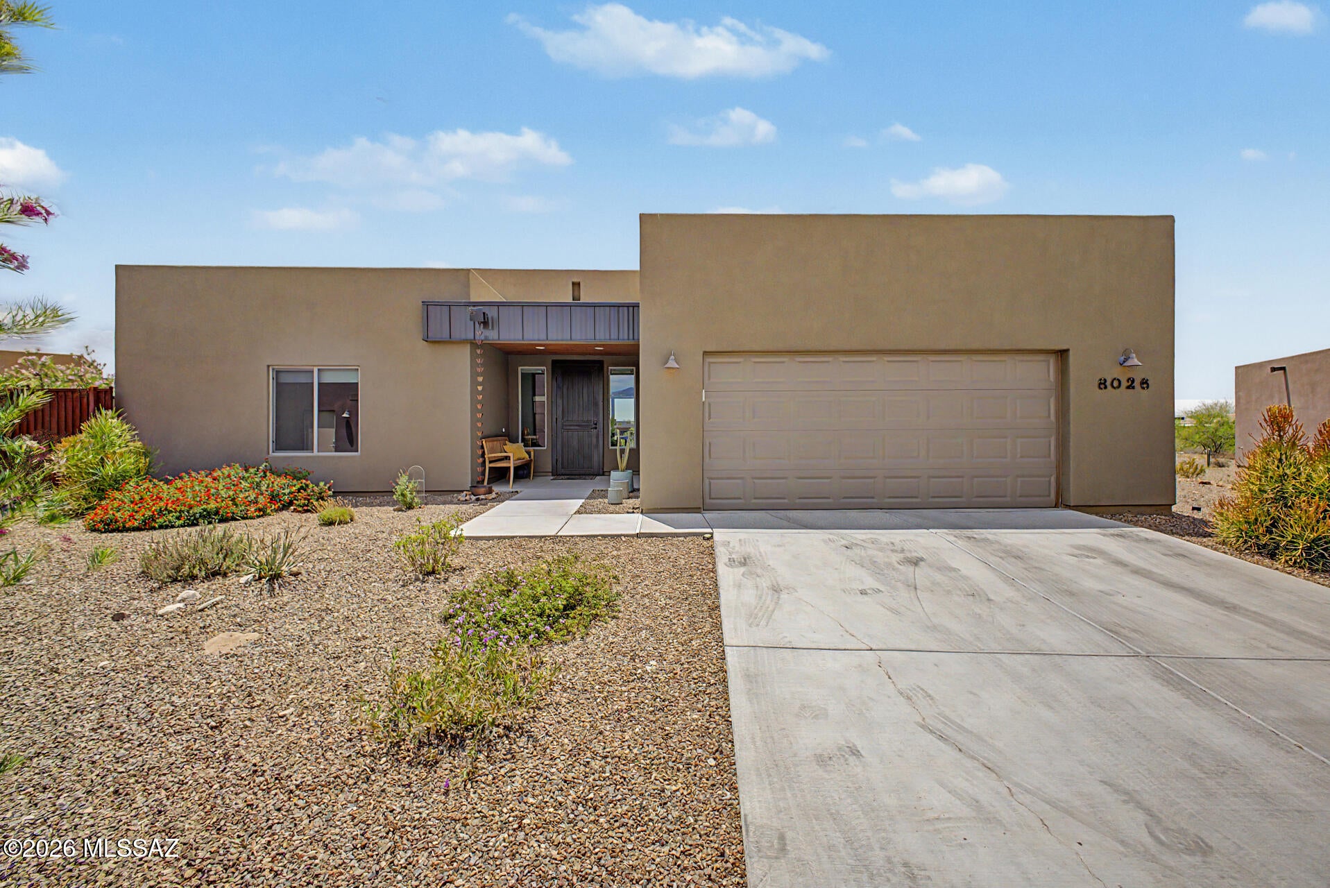 Welcome to the 55+ community of Academy Village! This beautiful 2023 built home features a split floor plan of 3 bedrooms and 2 full bathrooms, open concept living and kitchen areas, and beautifully designed, low maintenance landscaping! 8026 S Galileo features custom window coverings throughout and a powered sun shade on the covered back patio. The backyard is a true oasis- features a large covered area for dining and lounging, landscaped with low maintenance natural desert plants, and is fully fenced in. Split floor plan gives a very large primary bedroom, and on the opposite side of the home is a private second bedroom which is great for guests. Turn bedroom three into your dream office or hobby space!