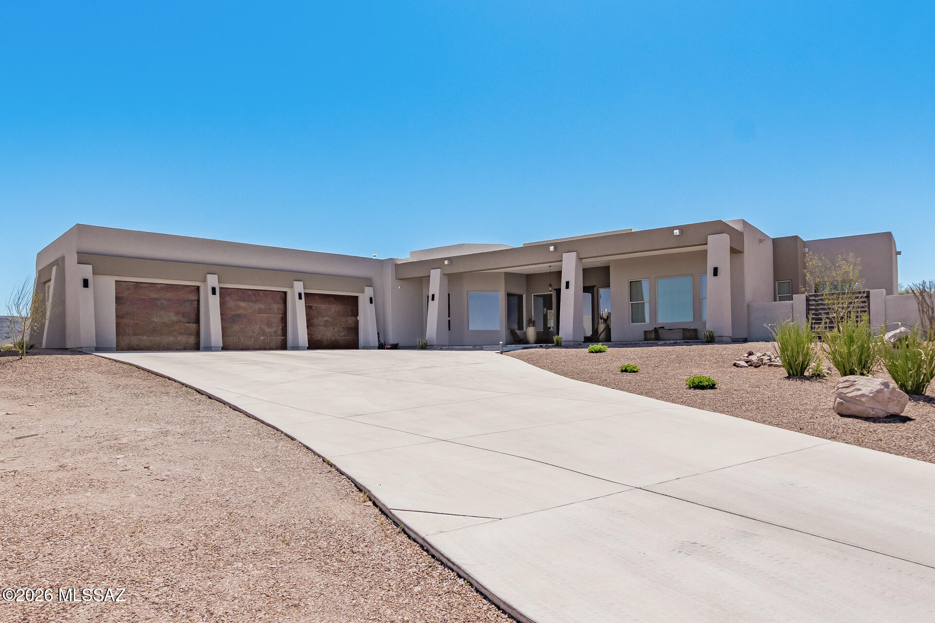 Welcome home! This charming residence boasts a perfect blend of modern and elegance.Step in to discover an open concept layout, with 12 ft ceilings and abundant natural light. The spacious living room offers an indoor and outdoor area.The custom kitchen offers stainless steel appliances and ample cabinet space. Enjoy casual meals on the breakfast bar or host a formal gathering in the dining area. Retreat to the master bedroom, with a complete walk in closet and a bathroom featuring double vanity, double walk in shower and a soaking bathtub. The three additional rooms offer flexibility for guest, home office, or playrooms. The expansive backyard offers mountain views, a built in grill, and plenty of space for outdoor entertaining.