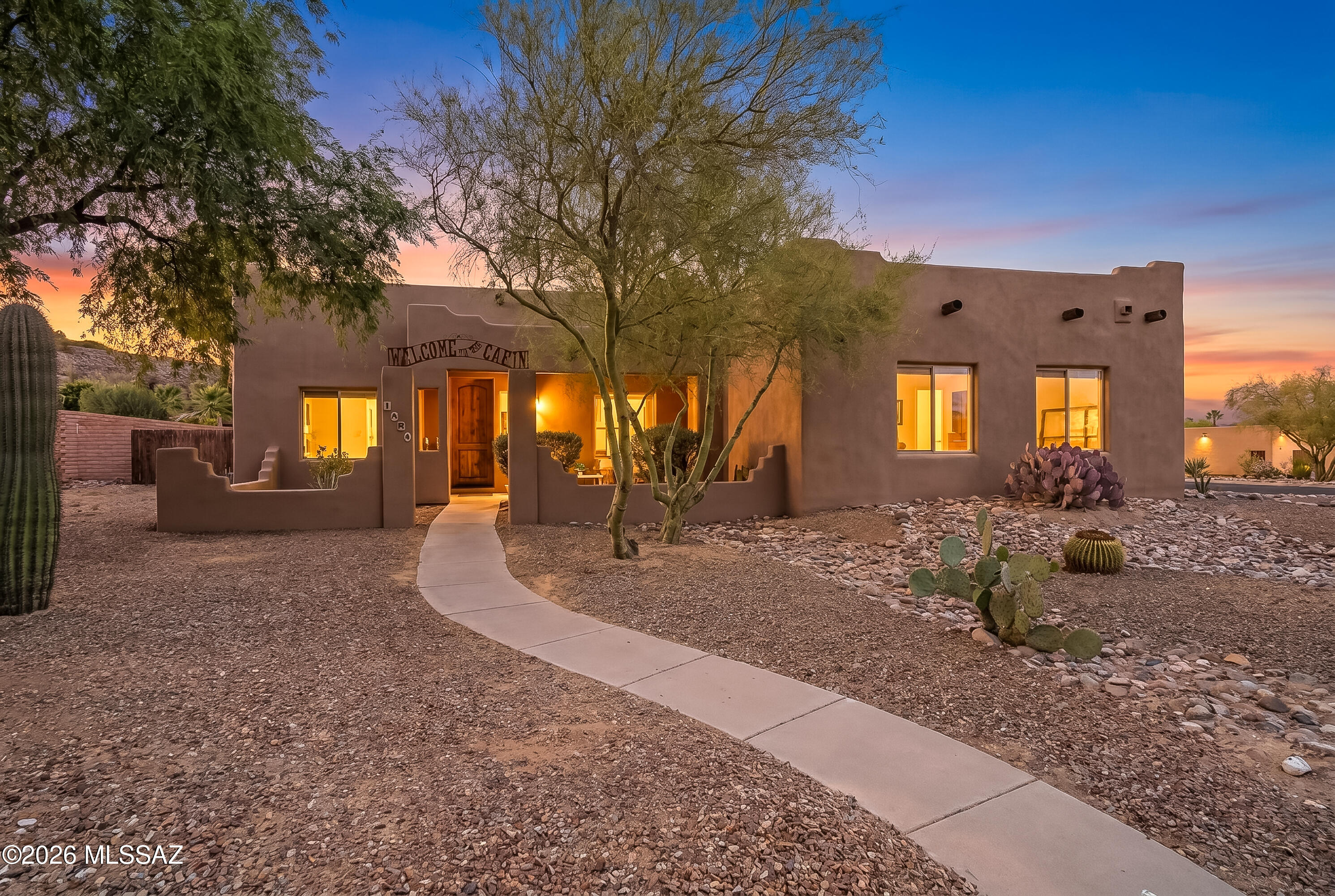 Welcome to this wonderful split floorplan 3-bedroom, 2-bath home situated on a spacious corner lot in desirable Sahuarita! This well-maintained property features a two-car garage and offers both comfort and style throughout.

From the front porch, where you can enjoy your coffee in the morning and lemonade made from your own lemon tree in the afternoon, step through the foyer to find the living area highlighted by a unique shelf wall--perfect for showcasing your décor and letting your creative side shine. Large great room has space for formal dining and living.  The kitchen has plenty of space for a breakfast nook, lots of storage and newer appliances.  Laundry room off the kitchen has even more storage and utility sink. Primary bedroom offers privacy and space and large walk in closet.  Enjoy the jetted tub in the primary bathroom! Step out onto the back patio from primary bedroom sliders, and take a dip in the pool.

Outside, you'll fall in love with the beautifully landscaped backyard featuring your delicious abundantly producing lemon tree (this is where you'll get the lemonade you're drinking on the front porch, remember?), real grass, a sparkling pool, and an outdoor bar that's perfect for enjoying Arizona evenings with star gazing and hosting guests.  Spot the many different bird species as they pass on their migratory path, and enjoy the quiet serenity of this oasis. 

Located in a beautiful neighborhood with large lots, mature trees and beautiful desert plantings.  This home is not located within the GVR.