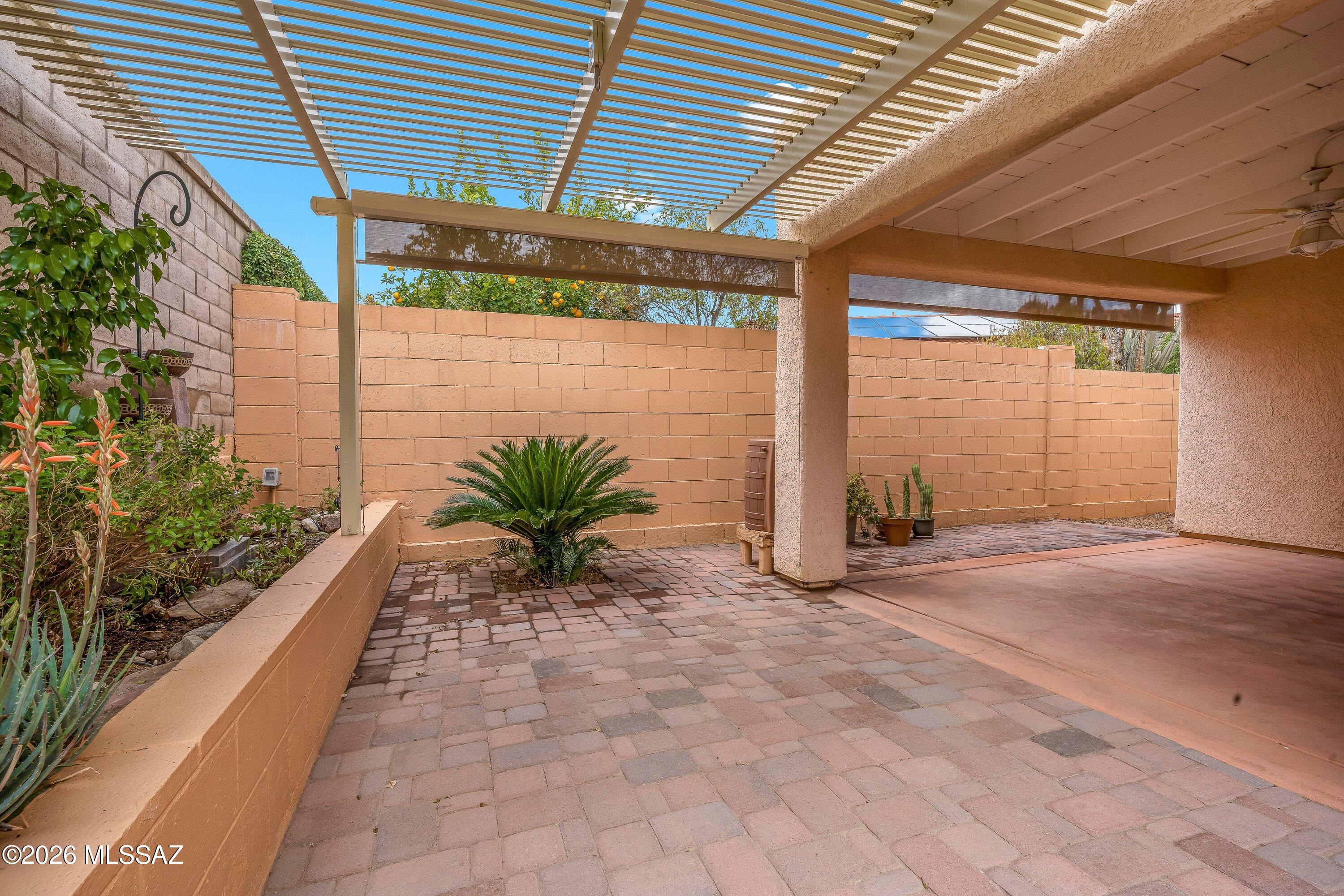 What if your electric bill was drastically lower--and your home was completely move-in ready? This beautifully maintained single-story home offers a rare Tucson combination: OWNED SOLAR, brand-new energy-efficient windows, and low-maintenance living in a quiet gated community of just 51 homes. At 1,582 sq ft, the open layout features 3 bedrooms, 2 bathrooms, and a versatile den ideal for an office or guest space. MOVE IN READY! The kitchen includes granite countertops, an induction oven, and ample storage. Step outside to a private, professionally landscaped backyard with a peaceful fountain and nearby community pool. Just minutes from shopping, dining, and daily conveniences. Ideal for downsizers, snowbirds, busy professionals or anyone seeking comfort and energy savings.
