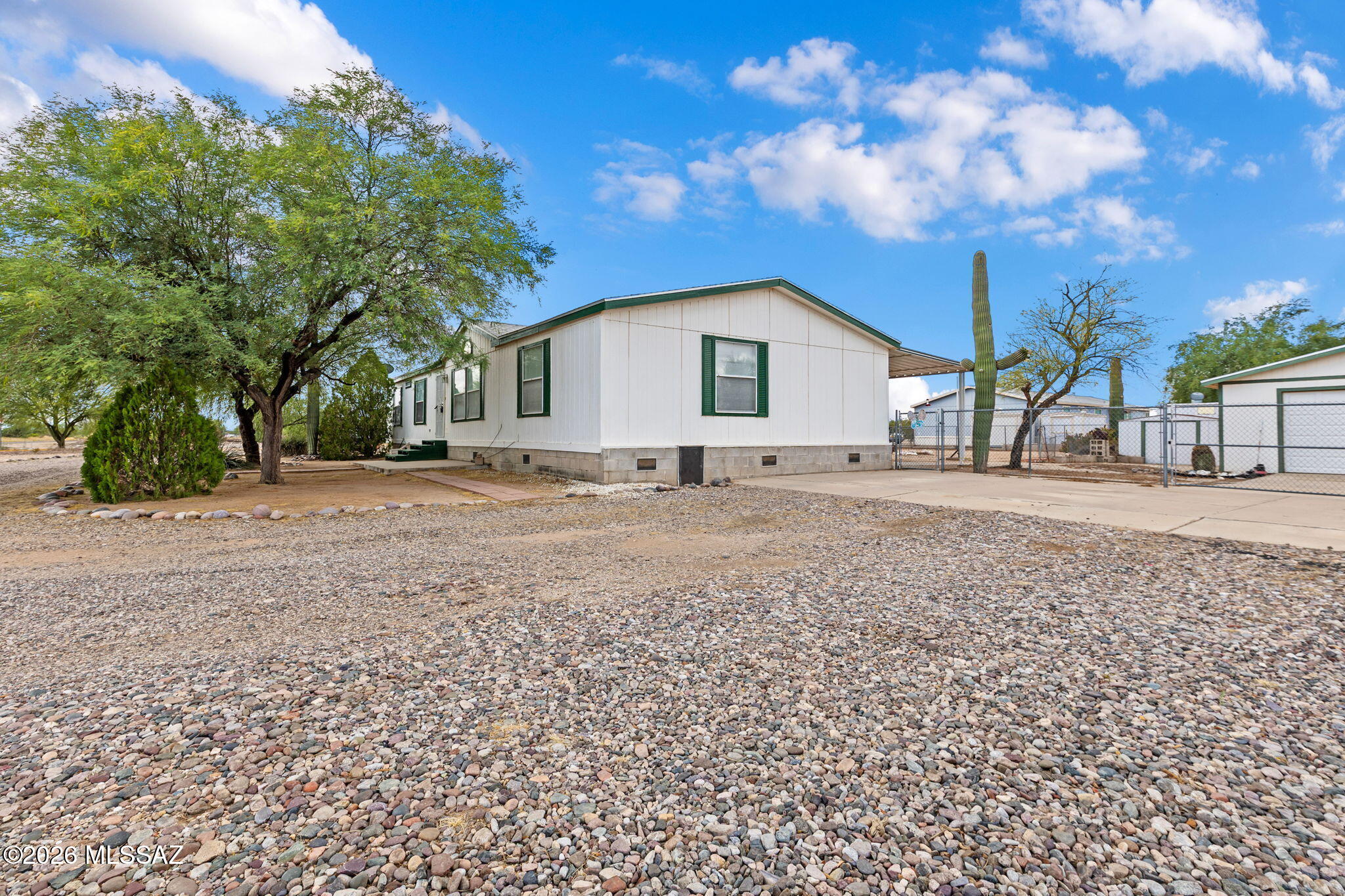 1997 Built 3 bed, 2 bath modular with full 2 car detached garage/workshop. Located on just under an acre on a fully paved road, this home is right on the corner of Anway and Peccary Ln. Easy access, to freeway, and a quick drive to schools, and the new Gladden Farms Frys Marketplace and shopping centers. Room to grow, and a place to park your cars, toys and more. Also, full length covered patio on back side, and all new carpet throughout. Primary Suite includes large soaker bath tub, dual sinks and a separate shower. Truly move in ready, with new stove installed in April. Refrigerator, microwave, and washer dryer all convey to new owner. Call to set up a private showing today!