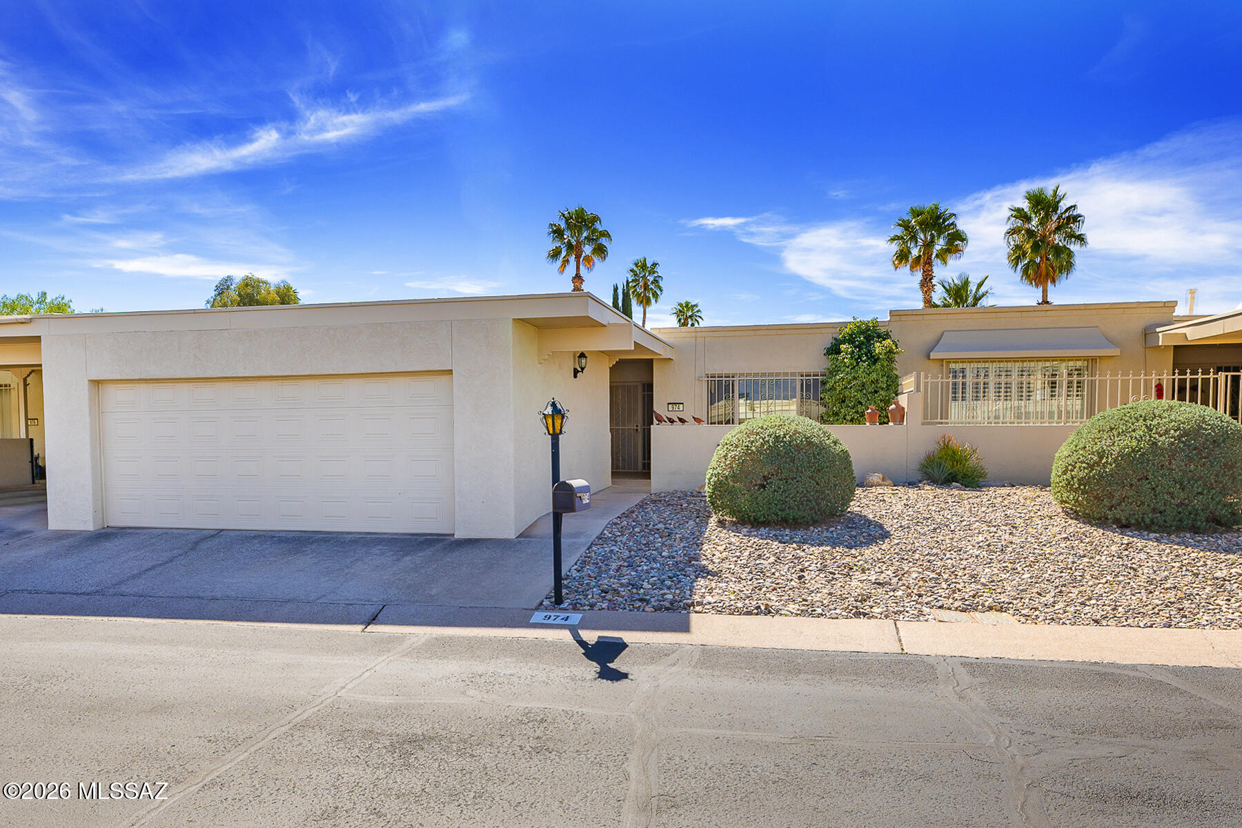 Single Story Townhouse w/ Mountain Views from the living rm & dining rm areas. 2 large Primary bedroom suites.  One suite w/ a large  walk-in closet, plus a double door closet. Kitchen has a rolling island, pantry & a stackable washer & dryer. Also a Bonus rm that could be used as a workout, den/office space. 2 Car garage, No carpet, multiple skylights & a lg storage area access from inside or outside.  Tuff Shed w/ 2 windows stays. It was used as an art studio. Enjoy your mountain views from your front patio or dine & relax on your paved covered backyard patio. Low monthly HOA fees with pool. Convenient location for golf, parks and restaurants. Move in Ready. Great for year round residents or winter visitors. Lock & leave w/ security screen doors & security bar double pane windows.