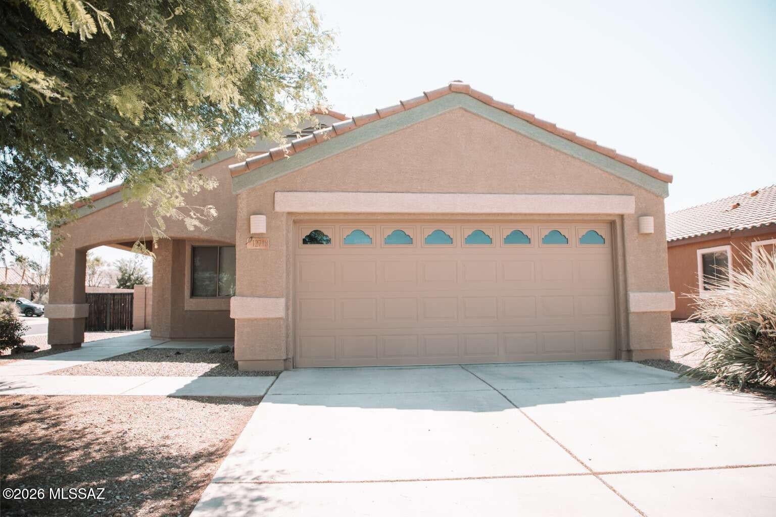Move-in ready in Gladden Farms! This 1,328 sq ft, 3-bed, 2-bath corner-lot gem in booming Marana offers a HUGE backyard, fresh exterior paint, and stylish new tile throughout. Enjoy a modern kitchen with granite counters & stainless appliances, plus a newer washer/dryer, A/C, and water heater. The spacious primary suite features a walk-in closet & double vanity bath. Perfect blend of upgrades, space, and location. Don't miss your chance to make it yours!