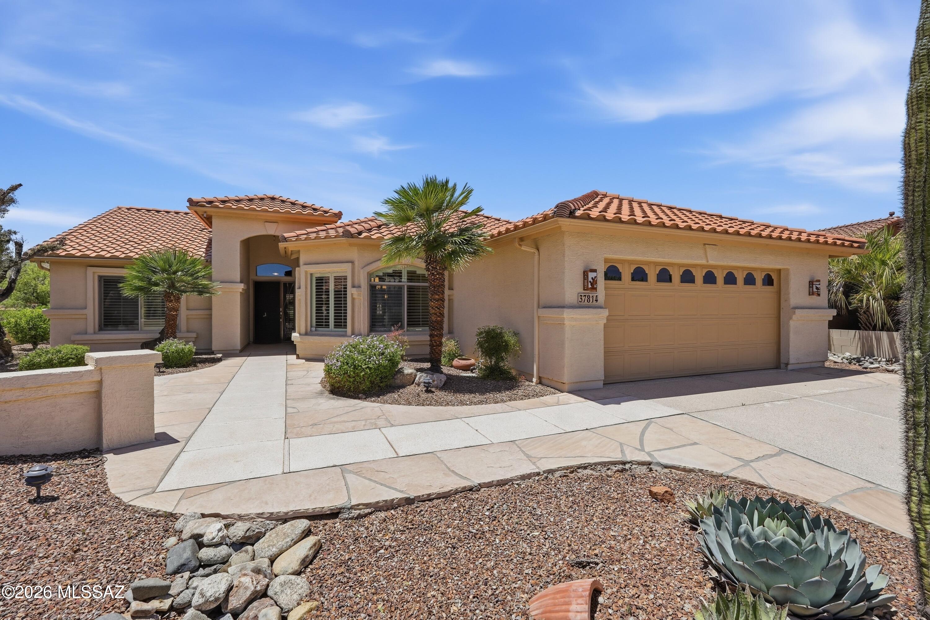Welcome to your ultimate high-desert retreat located near the end of a quiet, peaceful cul-de-sac in the premier active adult community of SaddleBrooke! This gorgeous single-story, recently updated, 3BD/2BA(1,951sqft) home delivers the perfect combination of neighborhood privacy, timeless design, and breathtaking panoramic golf course, mountain, and sunset views. Step past entry way to discover a bright and airy open-concept great room layout featuring high, sweeping ceilings and windows that invite in a flood of natural Arizona sunlight. The main living area is beautifully anchored by a cozy gas fireplace, creating the perfect focal point for those crisp desert evenings. The chef-inspired kitchen stands as a central culinary hub, packed with a great workspace and center social island. The thoughtful floor plan transitions effortlessly into three spacious bedrooms. The private primary owner's suite serves as a peaceful sanctuary, complete with a massive walk-in closet and a spa inspired bathroom. Outdoor living is an absolute dream in your private backyard oasis. The covered rear patio opens to low-maintenance desert landscaping, providing a private buffer zone that borders a common area along the rolling fairways. Whether you are hosting a weekend cocktail hour or watching the evening mountain colors change at sunset, this setting is pure magic. Located just a short ride from SaddleBrooke's championship golf courses, tennis, pickleball complexes, and resort pools, this home is ready for you to enjoy the Sonoran Desert lifestyle from day one!
