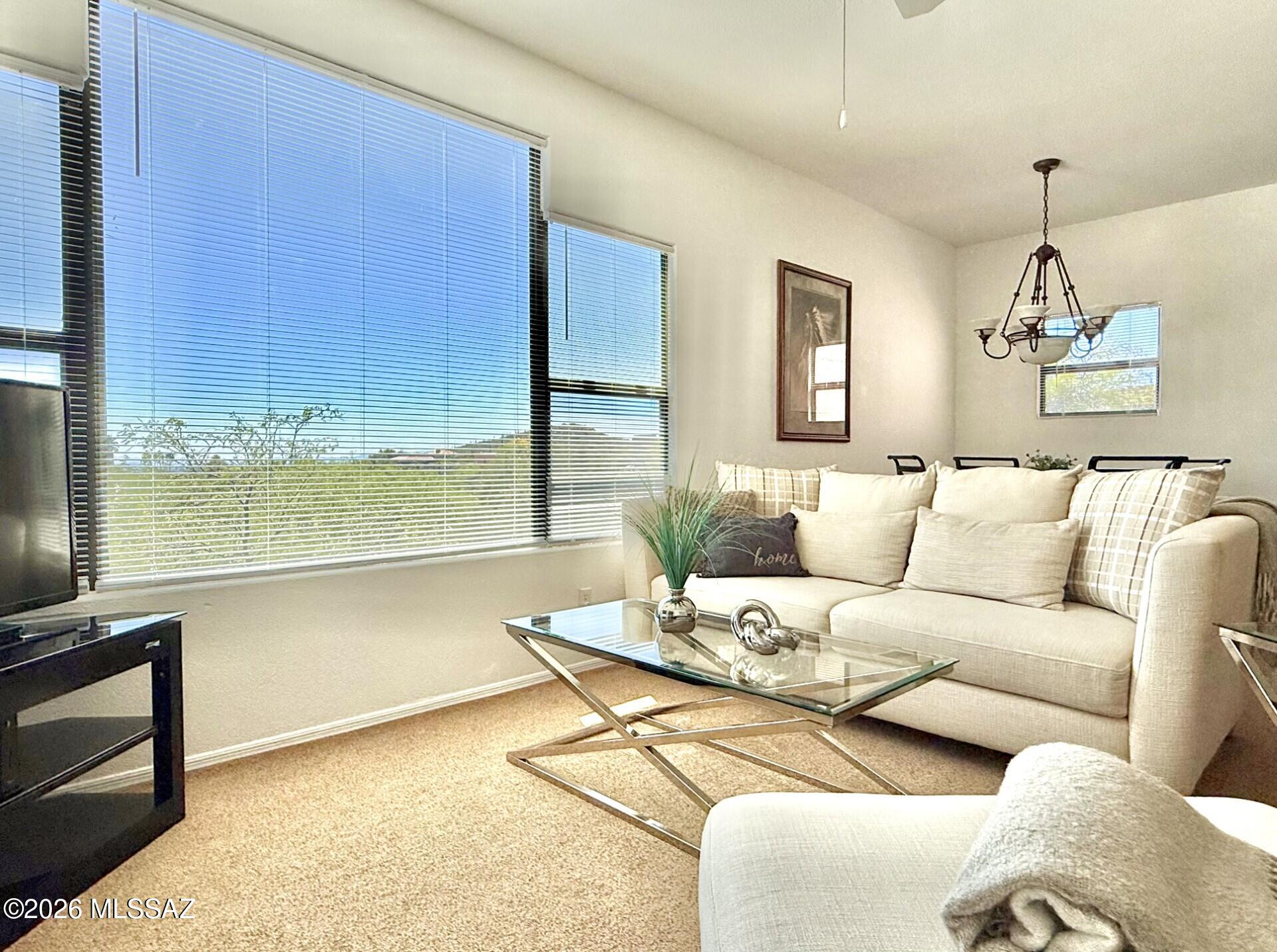 One of the few largest 2bed/2bath condos with the most beautiful views in the prestigious neighborhood of Ventana Canyon at the base of the Catalina Mountains! This elegant spacious 1077 sqft home features 9 feet high ceilings, a big picture window with spectacular city view, split bedroom plan, walk in closets, a bright screened in balcony with stunning mountain view. Stainless steel kitchen appliances (Fridgidaire Gallery). With private access to Ventana Canyon Trail just around the corner and only 10 minutes away from Sabino Canyon Recreation Area. The exceptional community offers resort-style amenities including 2 heated pools, 2 spas, private state-of-the-art gym & tennis court and 2 beautiful clubhouses with barbecue areas.