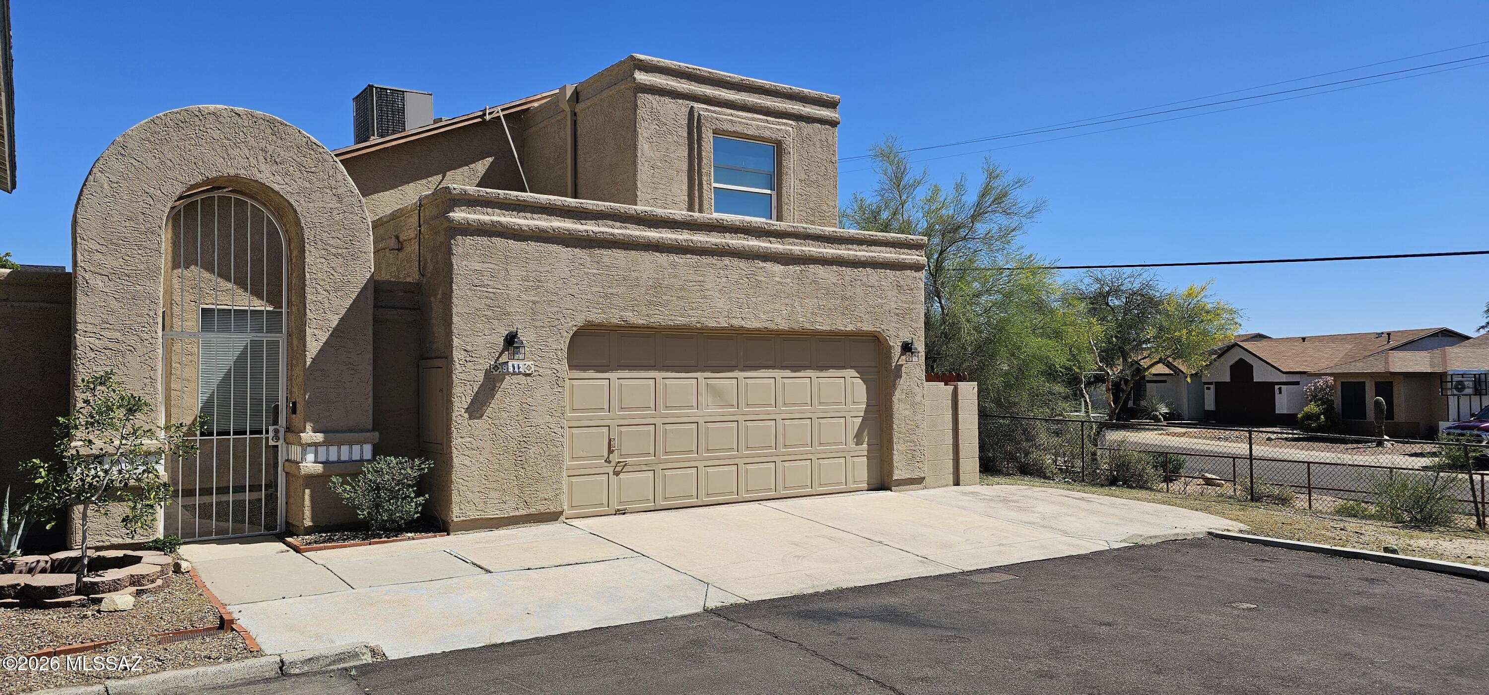 Welcome to this conveniently located Northwest Tucson home, located in a cul-de-sac with no neighbors on one side and just minutes from shopping, grocery stores, golfing and the I-10 freeway. The open, airy floor plan features a spacious living area, a large kitchen, and a private (east facing) backyard ideal for relaxing or entertaining. Great feature: The primary suite is located down stairs! 3 of the bedrooms include their own energy-efficient AC systems to help reduce summer cooling costs. The downstairs guest bedroom also features a separate entrance which is great for guests who want more privacy.