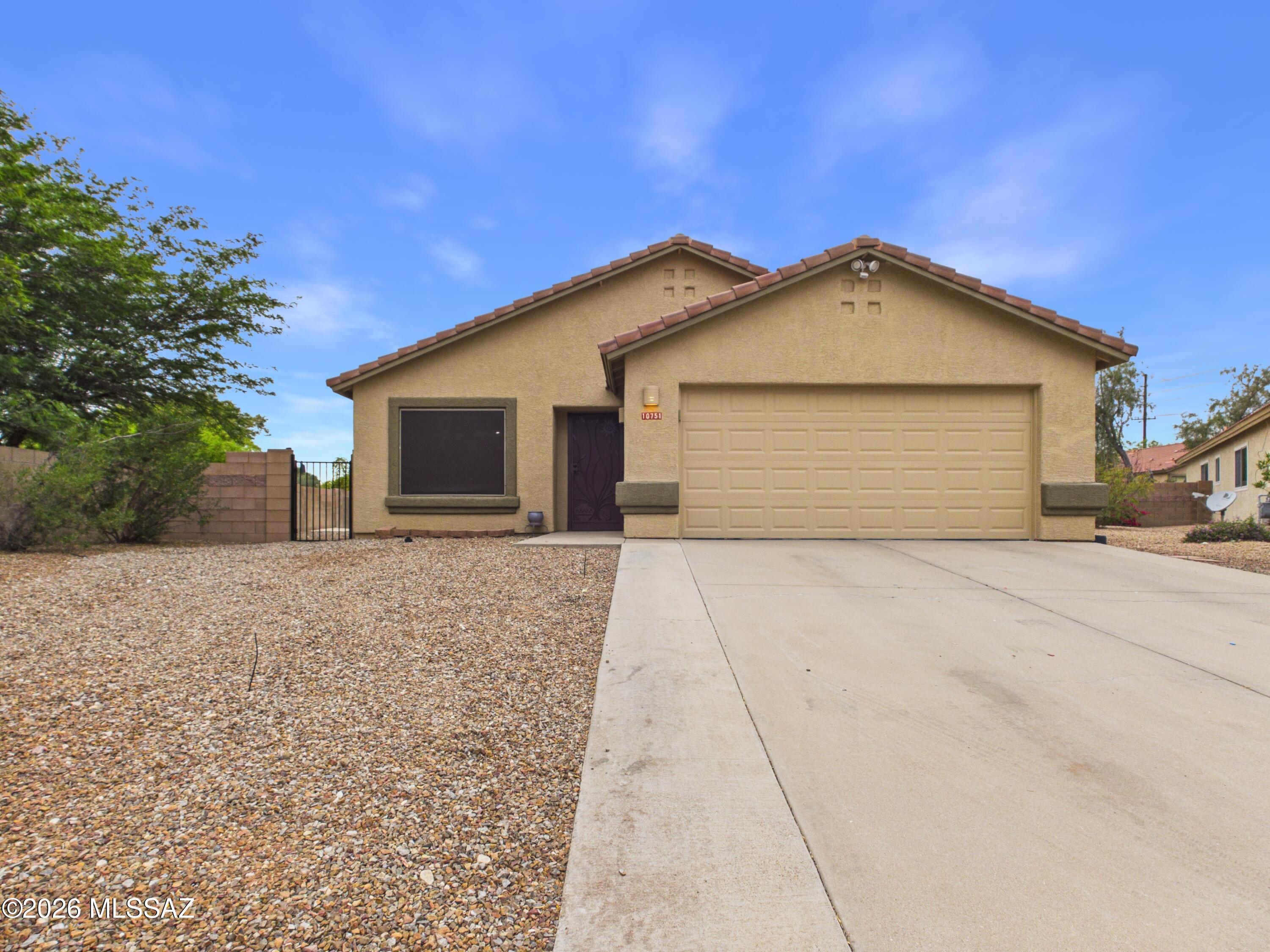 Welcome to this beautifully updated 3-bedroom, 2-bathroom home nestled on a quiet cul-de-sac in Oro Valley! At 1,409 sq ft, this home offers a thoughtfully designed layout featuring a updated  kitchen with quartz countertops, island, and an open dining room concept, ideal for everyday living and entertaining. The spacious primary suite boasts a generously sized bedroom and a bath with dual sink vanity, walk-in shower, and relaxing garden tub. Freshly painted with newer LVP flooring throughout, this home is truly move-in ready. Step outside to your HUGE backyard showcasing stunning mountain views, a pergola, covered patio turf grass, and bonus extended slab and brick patios, an entertainer's paradise! Conveniently located near shopping, dining, medical facilities, and top-rated schools