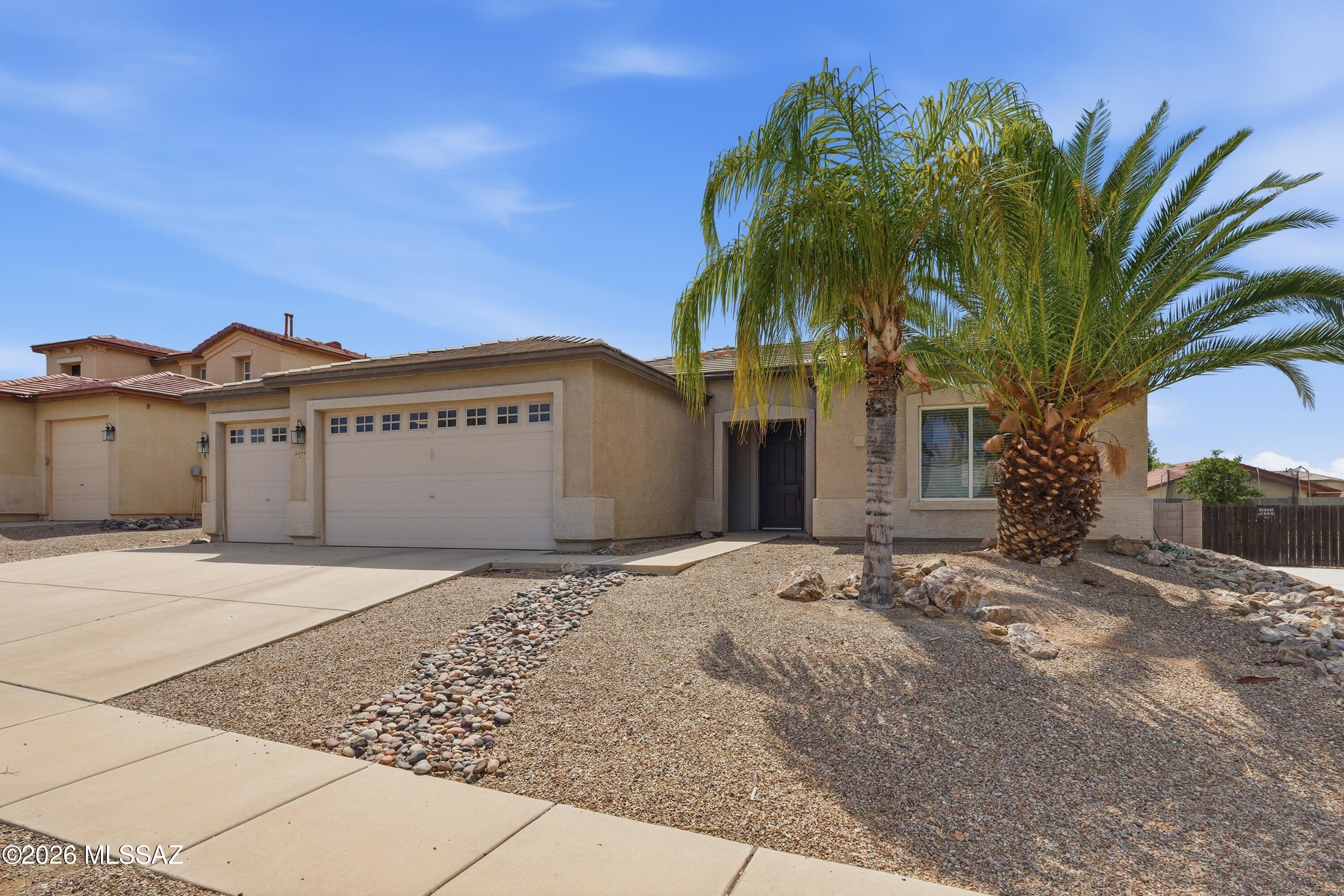 Beautiful 2005 KB built single-story home in the desirable Hartman Vistas community of NW Tucson! This spacious 2,045 sq. ft. floor plan offers 3 bedrooms, 2 bathrooms, plus a generous den for office or guest room space.The open-concept design features travertine tile throughout the main living areas, granite countertops in both the kitchen and bathrooms. Large Chef's kitchen w/ center island,newer SS appliances & custom cabinetry.The oversized 3-car garage w/ 3rd bay that opens to 
backyard & street driveway.All appliances convey.New HVAC 2026, Water heater 2025.Enjoy a beautiful & large backyard with a sparkling pool, creating the perfect space for relaxing or entertaining. Conveniently located near schools, shopping, restaurants, and multiple easy access to I-10.Move-In Ready to Enjoy!