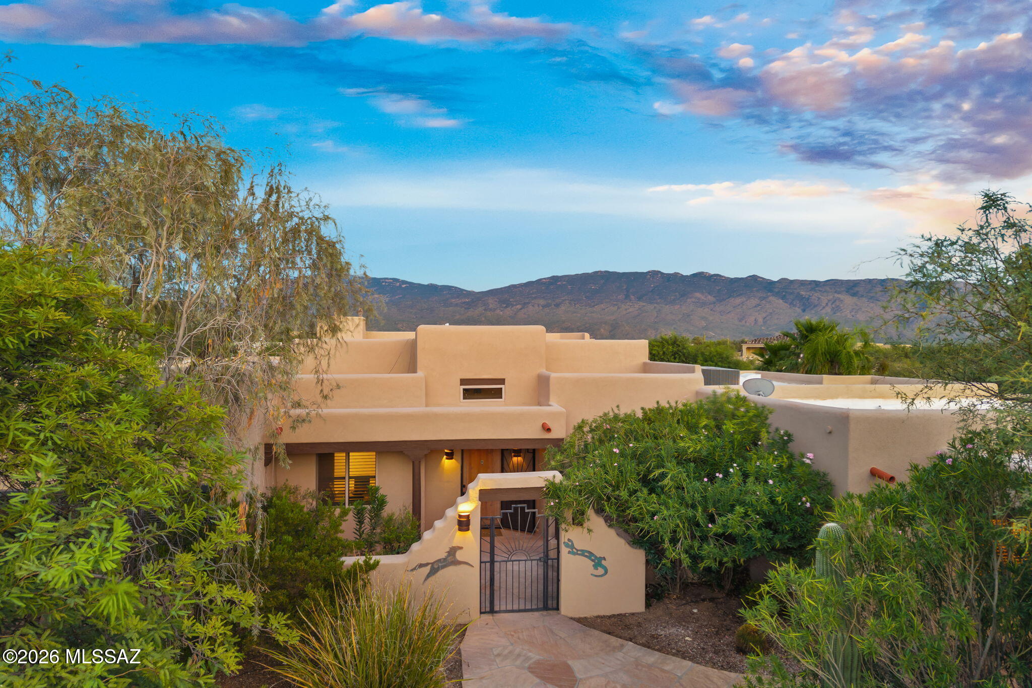 Where luxury, lifestyle, and mountain views come together. This exceptional 4-bedroom, 3-bathroom residence offers an elevated Tucson experience with fresh exterior paint, beautiful, beamed ceilings, recently updated bathrooms, a private surround sound home theater, dedicated office, and bonus room, plus a spacious 3-car garage. The backyard is built for both relaxation and entertaining, with a sparkling pool, expansive real grass, outdoor patio misters, basketball court, and three mature fruit trees. Equestrian enthusiasts will appreciate the three-stall horse setup and established fencing, while the generous grounds offer room for a future casita or guest accommodations. Just minutes from scenic hiking and riding trails, this property puts Tucson's outdoor lifestyle right outside your door while still offering the comfort and amenities of a private retreat. Entertain. Unwind. Ride. Play. Stay. With exceptional indoor spaces, resort-style amenities, and mountain views, 3000 N. Amethyst Lane offers a truly elevated Tucson lifestyle you've been dreaming of.
Owner related to listing agent.
