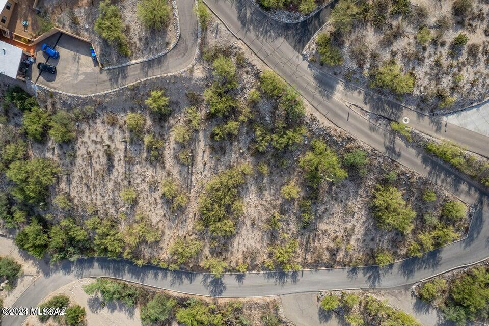 Seller will consider offers between $100,000-$125,000. Land costs (the land sale price)
Site Development estimate: $80,000 *estimate
Pike base price (spanish Elevation) $494,499 (*base price subject to change) Discover your desert oasis in La Buena Vida Estates. Subdivided lot ready for your custom home. Utilities to the lot line. Serene mountain/city views, and wildlife ambiance. Proximity to schools, shops, Sabino Canyon, UofA and downtown. Elevate your lifestyle - seize this opportunity now!