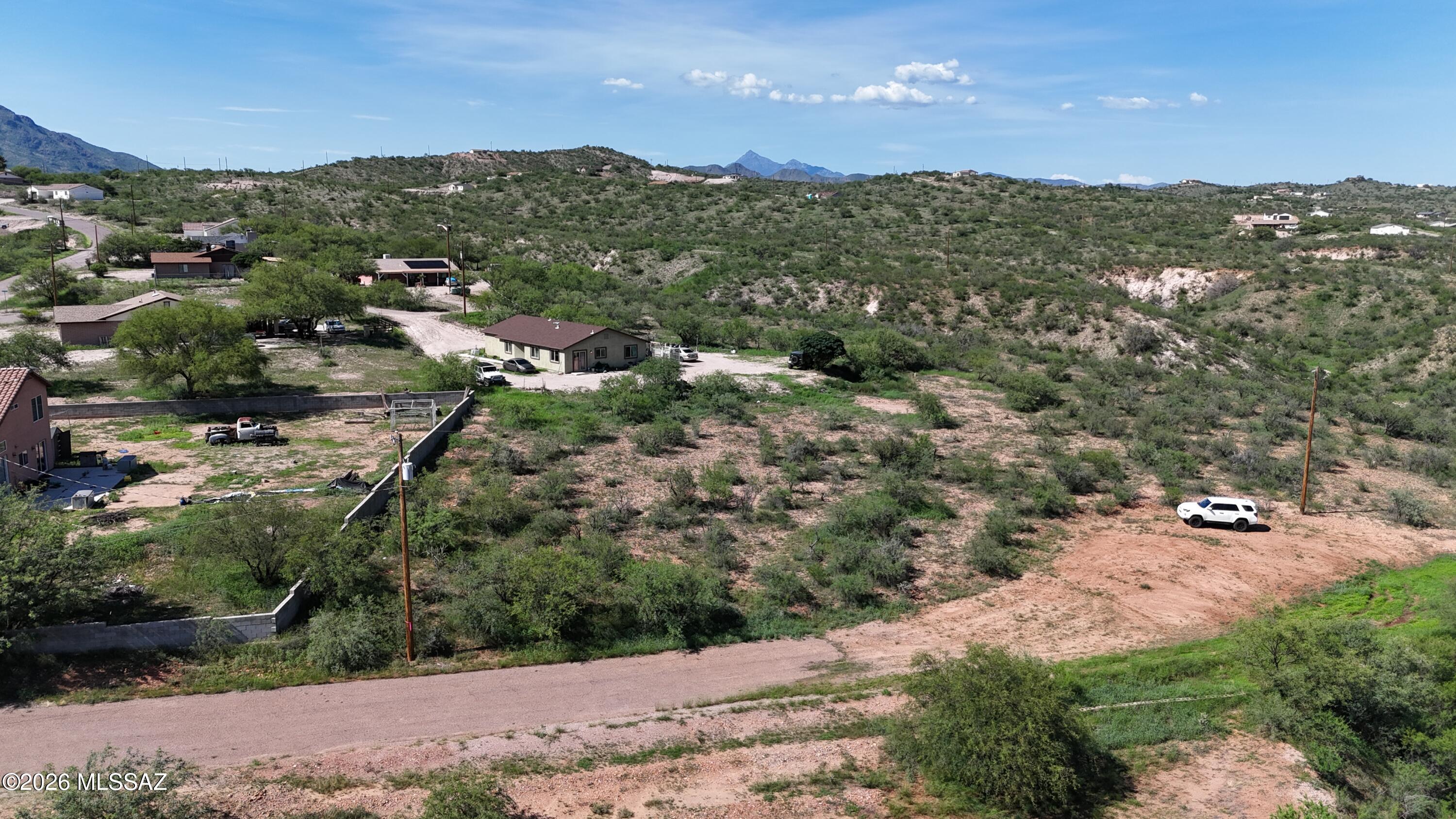 Fairly flat cul de sac lot with power poles and I believe water at the street.  I will upload the water verification under documents when I get it back from the water co.  Mountain views.