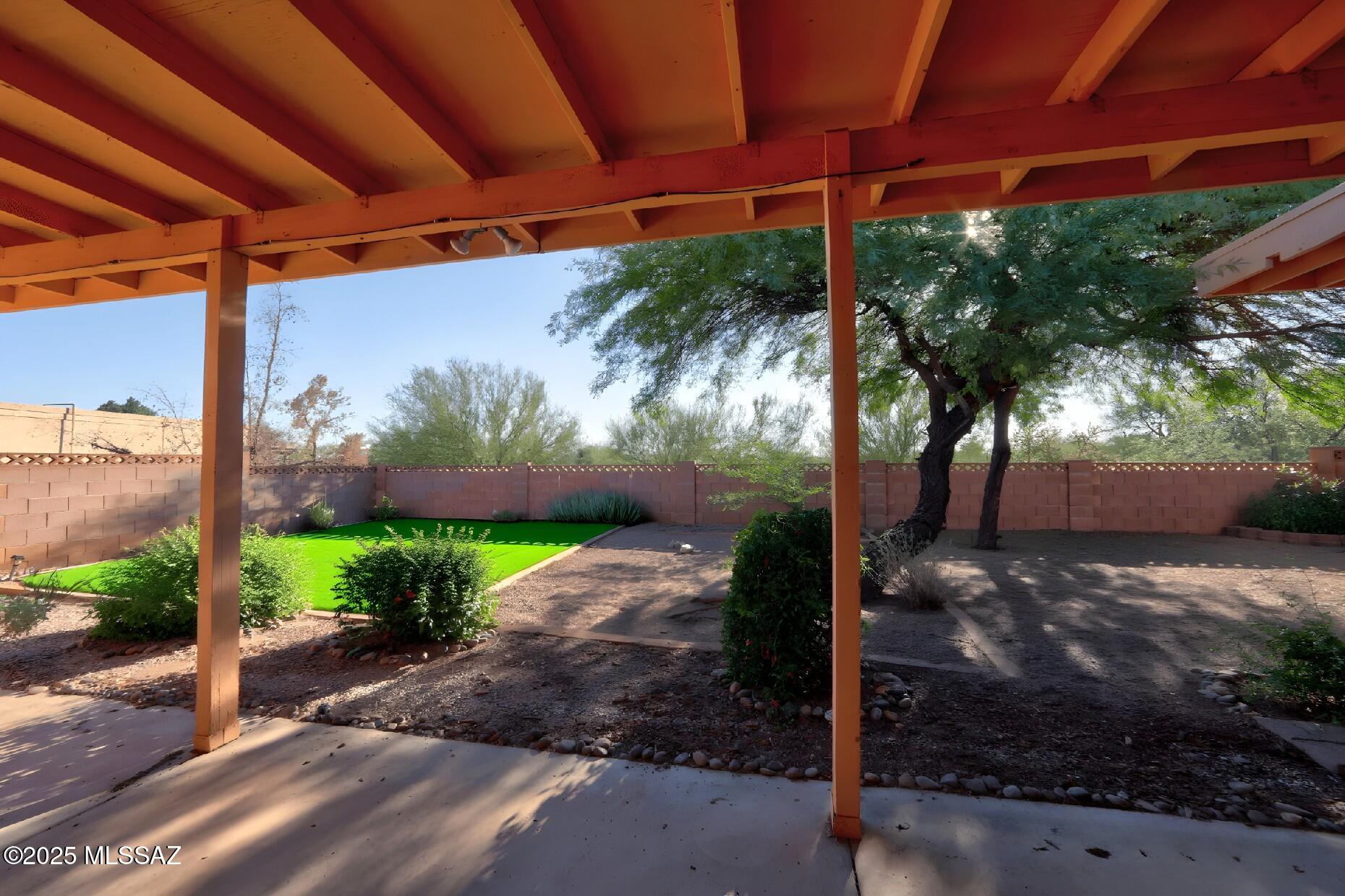 Catalina Foothills ranch style home with NO HOA and on over 3/4 acre. Home boasts tile throughout, both the master bath and hall bath with new vanities, sinks, and faucets. The kitchen has added a new fresh look with two tone cabinets and hardware. The HVAC system was recently replaced with a 14.5 seer Trane system as well as the water heater. All appliances stay. Relax in your backyard filled with large shade trees and a covered patio. You may feel like you?re out in the country, but you are close to shopping, medical, schools and all the amenities of the city.