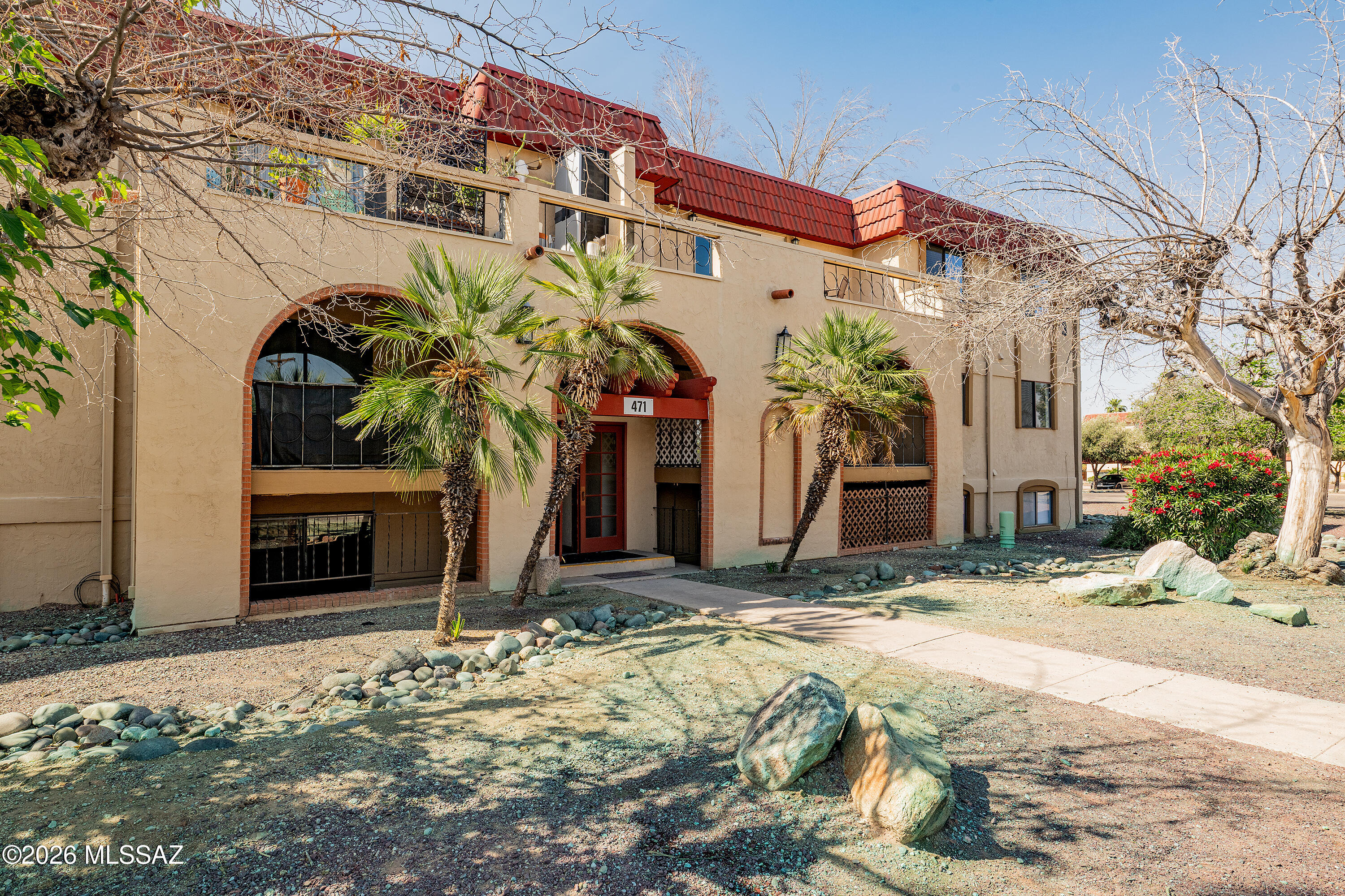 Large 3 bedroom 2 bath condo, in a popular NW location. Second story with a balcony facing the Catalinas. Additional small balcony off of the master bedroom. The entire condo has been just painted. Wood laminate floors, brand new carpet throughout, laundry room within the unit itself. Assigned covered parking spot, two pools, Club House (maybe be rented for large parties). HOA covers gas heat and cold and hot water, termites, roof and outside maint. Close to shopping, post office, restaurant, grocery stores and bus lines. Straight down Oracle Rd to Downtown.