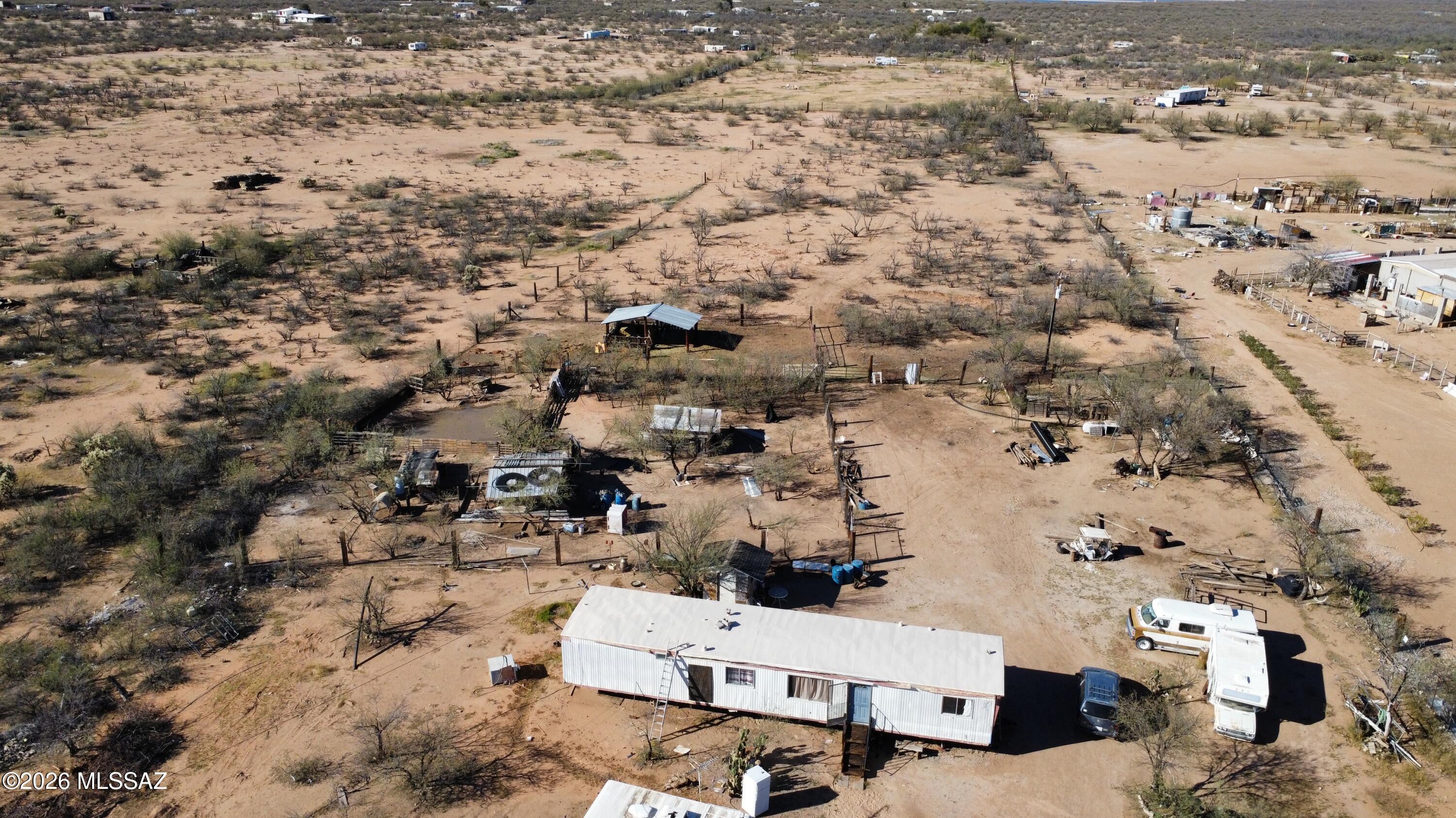 2 bed, 1 bath mobile home on 4.59 acres in Tucson, AZ! Enjoy peaceful desert living with plenty of usable land for animals, gardening, or expansion. Property includes established livestock--pigs, chickens, turkey, roosters, goats, and ducks--making it a turnkey mini-ranch or homestead opportunity. Open space, privacy, and beautiful mountain views with room for RVs, toys, and more. Country feel with convenient access to city amenities. Don't miss this unique acreage property!