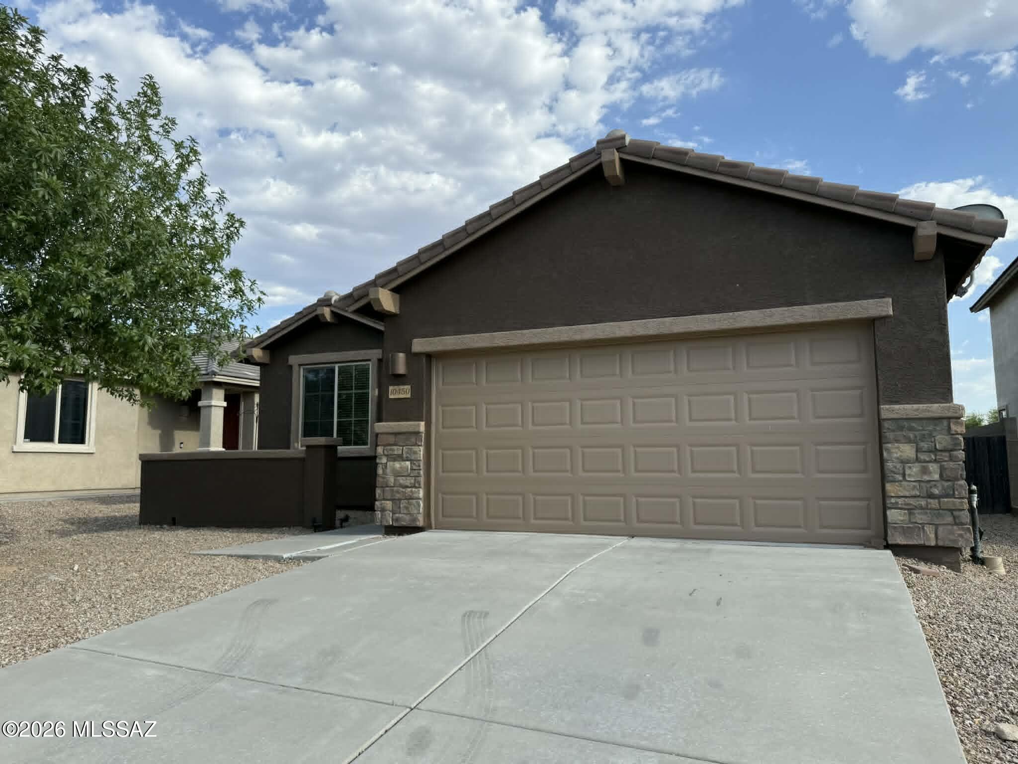 Charming 3 bedroom, 2 bathroom home located in the desirable Rancho Del Lago community in Vail, offering 1,397 sq. ft. of comfortable living space. This home features an open-concept layout with the kitchen flowing directly into the living room, perfect for everyday living and entertaining. The kitchen is equipped with granite countertops, updated cabinetry, and stainless steel appliances, including a refrigerator, stove, microwave, and dishwasher. The spacious primary suite includes a large walk-in closet and a sliding glass door that leads to a generously sized fenced backyard. Additional features include tile and carpet flooring, air conditioning, ceiling fans, garage parking, and laundry hookups. Residents enjoy access to community amenities such as walking paths, parks, and a pool.