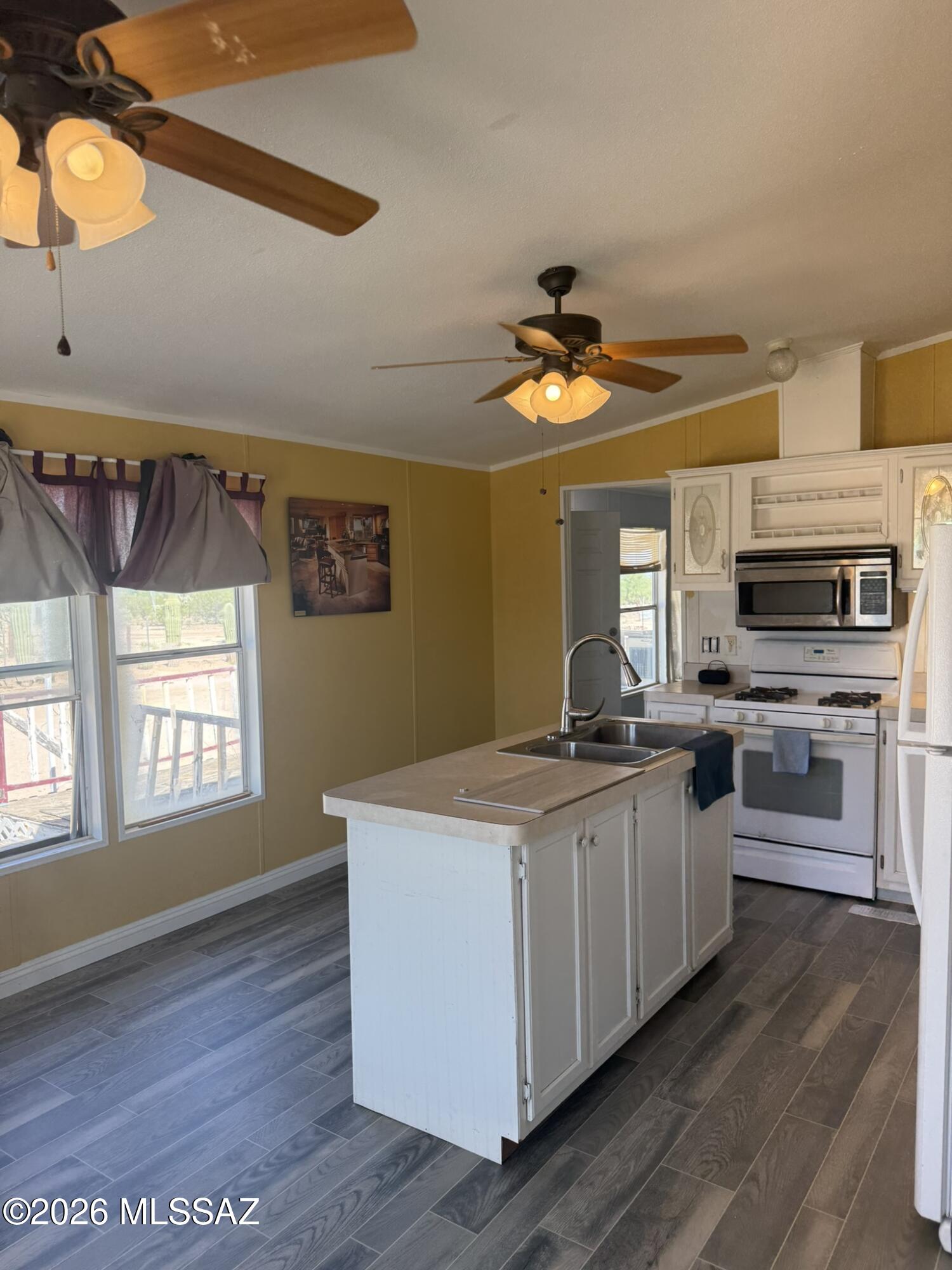 Enjoy panoramic desert and mountain views from this 1,456 square foot, 3-bedroom, 2-bath manufactured home situated on one acre in the Three Points area. Built in 2001 and affixed, the home offers a functional floor plan along with ample outdoor space, privacy, and the opportunity to enjoy Southern Arizona's sunsets and open desert surroundings.