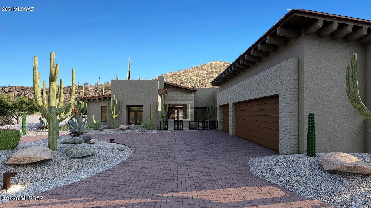 Rare opportunity to build a custom Southwest-style estate on 4.1 acres in Saguaro Ranch. This 4,337 sq. ft. residence offers refined desert living with thoughtfully designed indoor-outdoor spaces, dramatic architectural details, and an exceptional 8-car drive-through garage ideal for collectors and recreational use. Set within a private luxury enclave, the homesite provides space, privacy, and a true sense of retreat while remaining convenient to modern amenities. Architectural plans, renderings, and build by Pryce Homes, known for their exceptional craftsmanship and meticulous attention to detail, are included. This offers a seamless path to bring this vision to life and create a legacy property in one of Tucson's most sought-after communities.