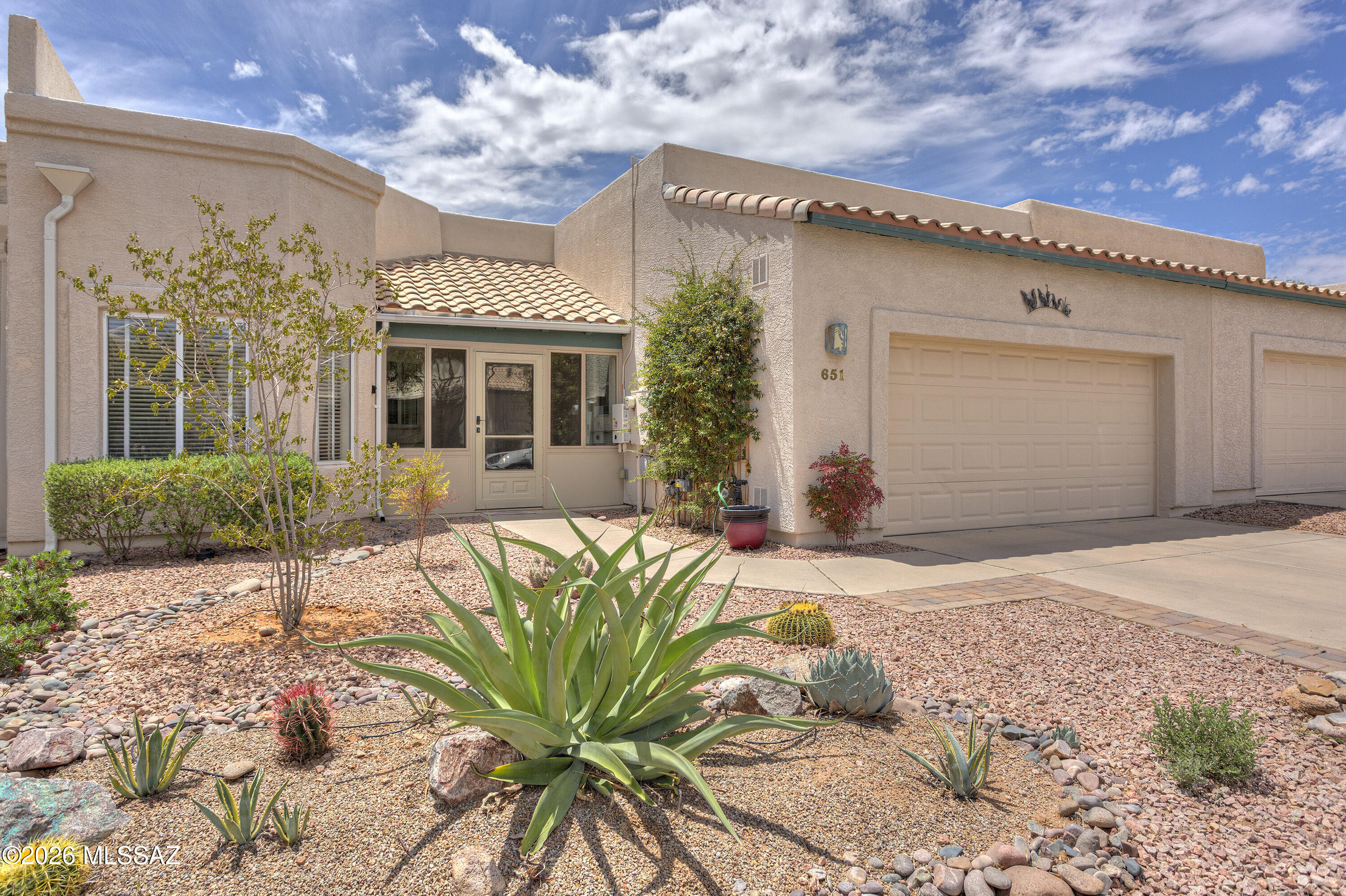Don't miss this centrally located Townhome with rear yard MountainView that backs to common area. 2 bedrooms with den with built in desk, 2 bathrooms. Breakfast nook, Double garage