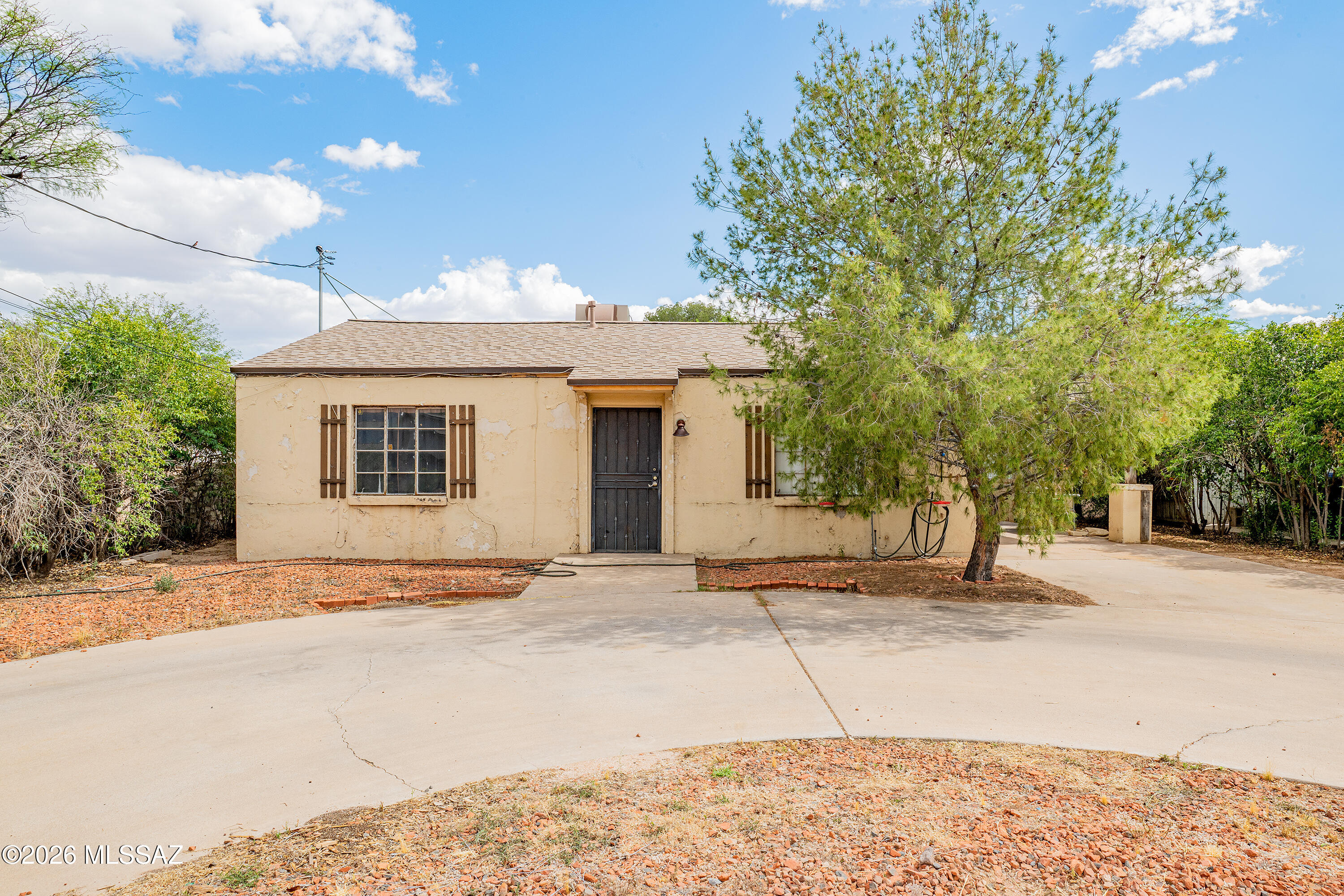Investment opportunity in central Tucson. Situated on an 8,000+ sq ft lot, this 2 bedroom, 1 bathroom home offers plenty of potential for renovation, expansion, or redevelopment. Features include a circular driveway, two storage sheds, and a spacious backyard with room to grow. Centrally located with convenient access to shopping, dining, and everyday amenities. Property to be sold as-is.

Water heater replaced in 2025. Electrical service updated in 2023, including new grounding and updated sub-panel wiring. Roof replaced in 2019.