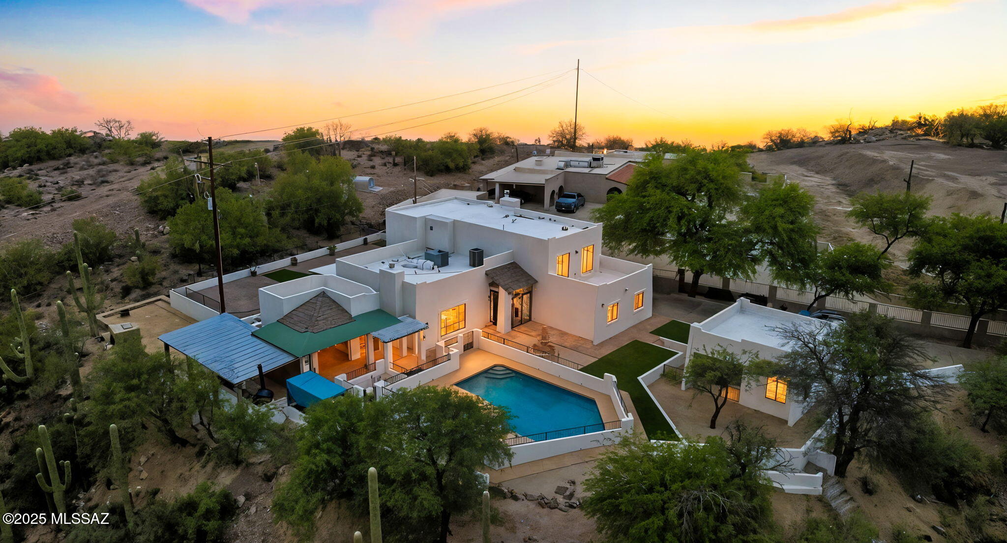 Welcome to your private desert retreat — a rare sanctuary that perfectly blends the tranquility of the Sonoran Desert with the convenience of city living. Nestled on 1.09 acres surrounded by majestic saguaros and mature mesquite trees, this stunning 4-bedroom, 4-bath home spans 3,035 square feet of beautifully designed living space.
From the moment you arrive, you'll be captivated by the home's natural setting, with endless desert views and the gentle breeze that sweeps through the property. Each sunrise paints the sky with color and captures the beauty of the city below, while evenings bring the peace and quiet of a secluded oasis. Wildlife is abundant, with frequent visits from javelinas, coyotes, bobcats, and even the occasional possum — a true desert experience. Despite its serene setting, the property is just 12 minutes from downtown Tucson, providing the perfect balance of privacy and convenience. You're only minutes away from excellent restaurants, shopping, and the scenic walking trails of the Tucson Mountains  all easily accessible yet comfortably removed from traffic and noise.
Inside, every detail reflects thoughtful design and craftsmanship. The home features custom interior paint, a combination of tile and wood flooring throughout, and countless upgrades that elevate both comfort and style. The spacious kitchen is ideal for preparing gourmet meals and entertaining, while the large family and television room creates a warm, inviting space for gatherings with friends and loved ones.
Outdoor living is equally impressive. Expansive gathering areas are finished with classic Saltillo tile, complementing the natural desert surroundings. A sparkling pool offers the perfect place to cool off under the Arizona sun, complete with a convenient outdoor shower for quick rinsing after a swim. The covered Ramada provides additional space for outdoor dining or evening relaxation under the stars.
This exceptional property offers 3,035 square feet of comfort and sophistication, all set within a private 1.09-acre lot that celebrates the best of desert living. Whether you're seeking tranquility, natural beauty, or space to entertain, this home delivers a lifestyle unlike any other  peaceful, elegant, and distinctly Tucson.