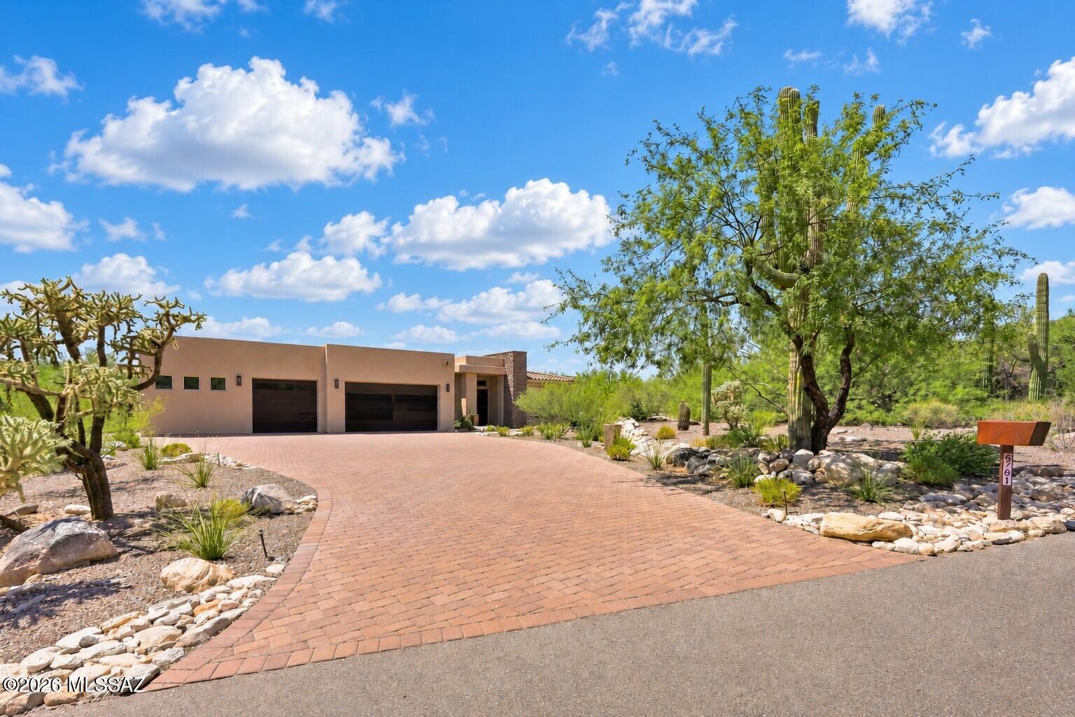 Quality throughout this stunning custom AF Sterling home in desireable Coronado Foothills Estates. Prestigious presentation w/paver drive & grand wrought iron entry doors. Thoughtful flooplan has open concept living, kitchen & dining along w/spacious bedroom, office, & flex room options. Seller took great care in upgrading all aspects including integrated rolling shutters, central vac, high-end Bosch & Thermador appliances. Solid wood doors, heated floor in primary bath, large format tile, tankless hot water & whole house water filtration. Home pre-plumbed for gray water system, water softener, firepit gas line & pre-wired for solar & 220 volt outlets in expanded 3 car garage. Professionally landscaped creating inviting entertainment areas w/views, built-in grill & water feature. Fabulous!