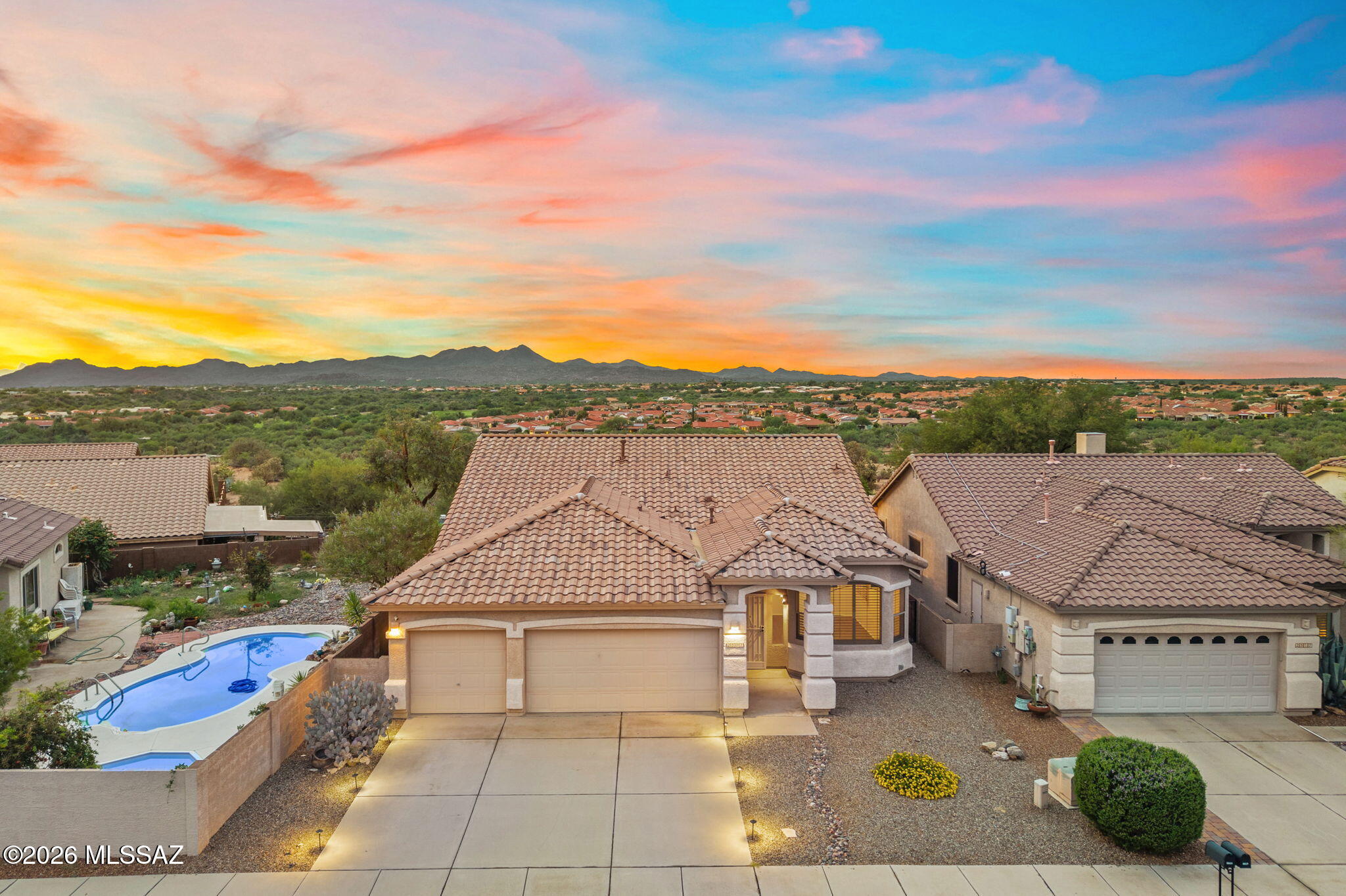 Located in the highly desirable Rancho Vistoso community, this beautiful single story home sits on an incredible view lot with stunning Arizona sunsets. Offering 2,020 sq ft, 4 bedrooms, a spacious den, 2 bathrooms, and a 3 car garage, the home features a functional floor plan with generous sized bedrooms and large closets. The backyard is truly what makes this home special, with an extended covered patio, expansive paved courtyard, mature desert landscaping, tranquil water feature, and fire pit, creating the perfect setting to enjoy Arizona living year round. Beautiful desert views and colorful sunsets provide an incredible backdrop for relaxing or entertaining. A new tile roof adds to this Oro Valley home, offering the space, setting, and lifestyle that make Rancho Vistoso so desirable!
