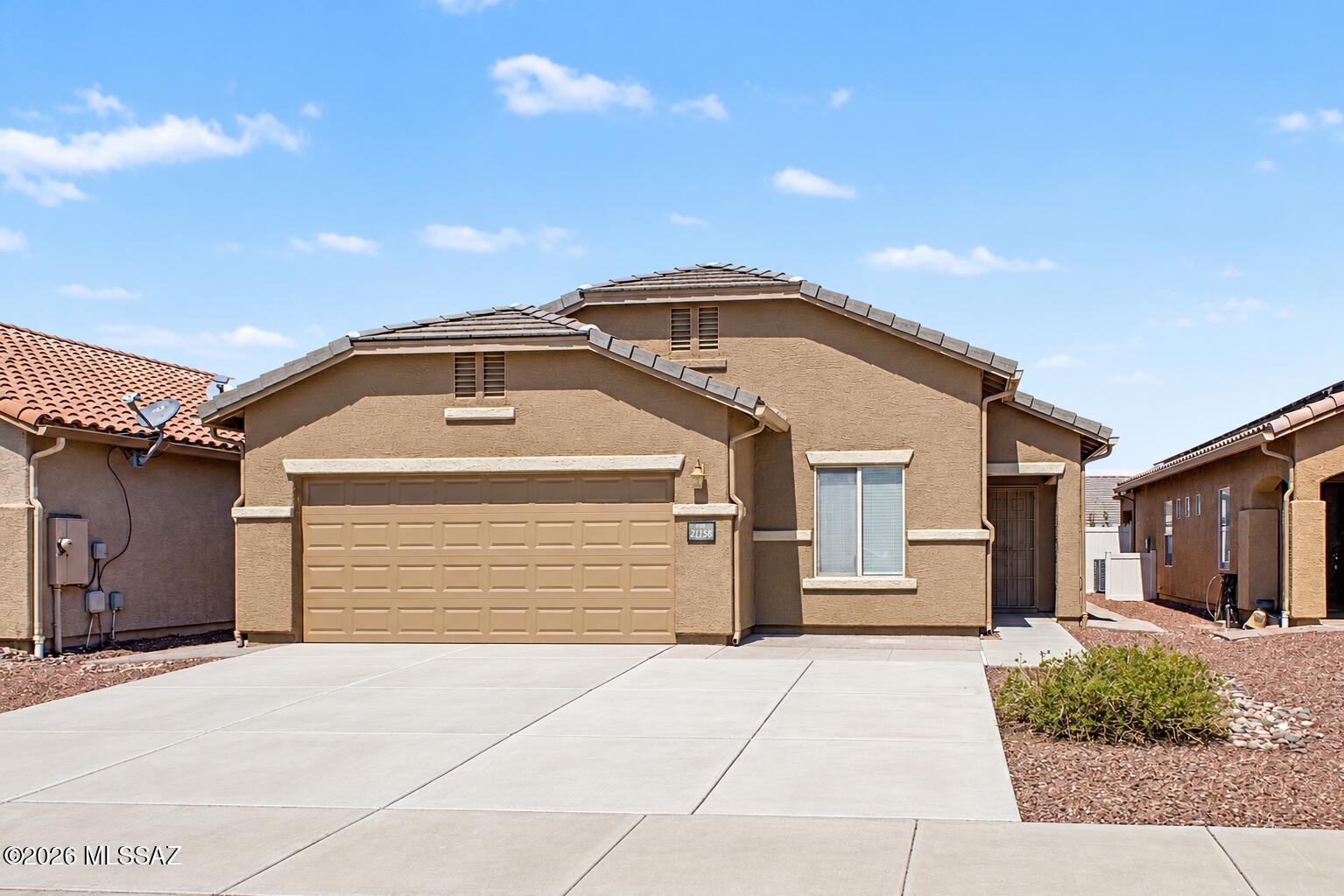 Welcome home to this beautifully refreshed 4 bedroom home featuring tile throughout the main living areas and brand new carpet in each bedroom. Fresh interior paint gives the home a clean, move-in-ready feel. Enjoy added peace of mind with a newer HVAC system and water heater. Outside, the low-maintenance backyard features artificial turf, while an extended driveway provides additional parking. Paver walkways along both sides of the home add convenience and a finished touch. This well maintained home is ready for its new owners!