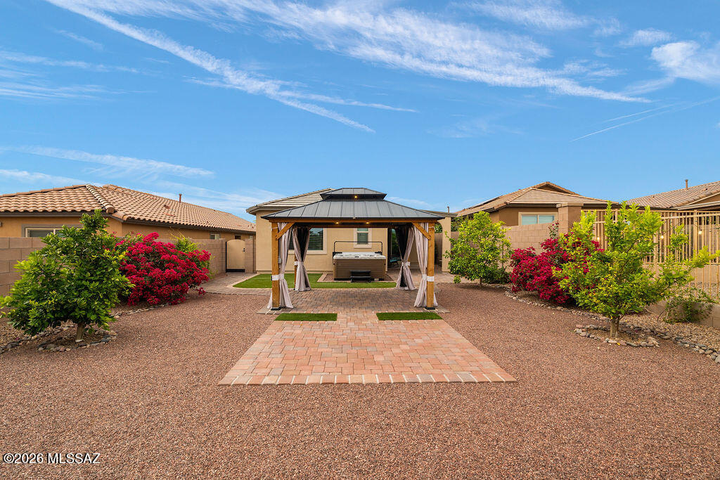 Welcome to easy desert living in this better-than-new, beautifully maintained 2022 single-story home offering 4 bedrooms/2 bathrooms with the perfect blend of comfort, convenience, and outdoor living -- all with no rear neighbors for added privacy. Ideally located near schools, parks, shopping, dining, hospital and easy highway access located in this vibrant community featuring pools and splash pool, basketball, volleyball, tennis courts, multiple parks and more.
Thoughtfully designed and move-in ready--this home features WiFi-enabled HVAC, upgraded finishes, and thoughtful improvements throughout. Enjoy outdoors with one of the best backyards in the neighborhood featuring an extended patio, custom gazebo, spa, pavers, turf, mature landscaping & peaceful desert views.