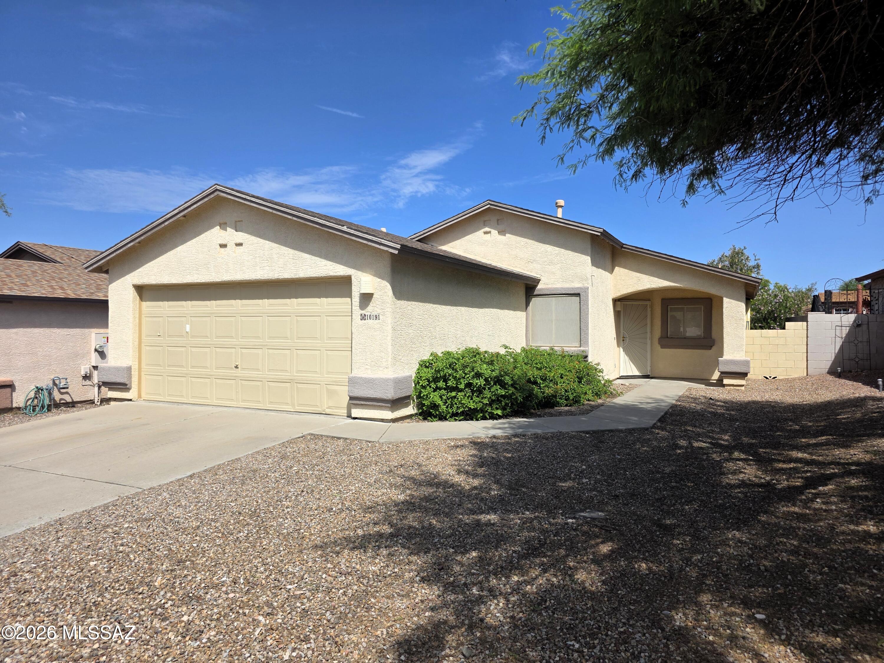 Welcome home to this charming gem in Rita Ranch, located in a growing area surrounded by exciting new restaurants and local stores. High ceilings and well-placed windows maximize gorgeous natural light while ensuring complete privacy. Inside, enjoy stunning stamped concrete floors and a beautifully built-in custom dining area. The spacious primary bedroom features a large primary walk-in closet designed for convenience. Step outside to a patio perfectly shaded during both the morning and evening, offering an ideal setting to relax and enjoy the surroundings--all located within the award-winning Vail School District.