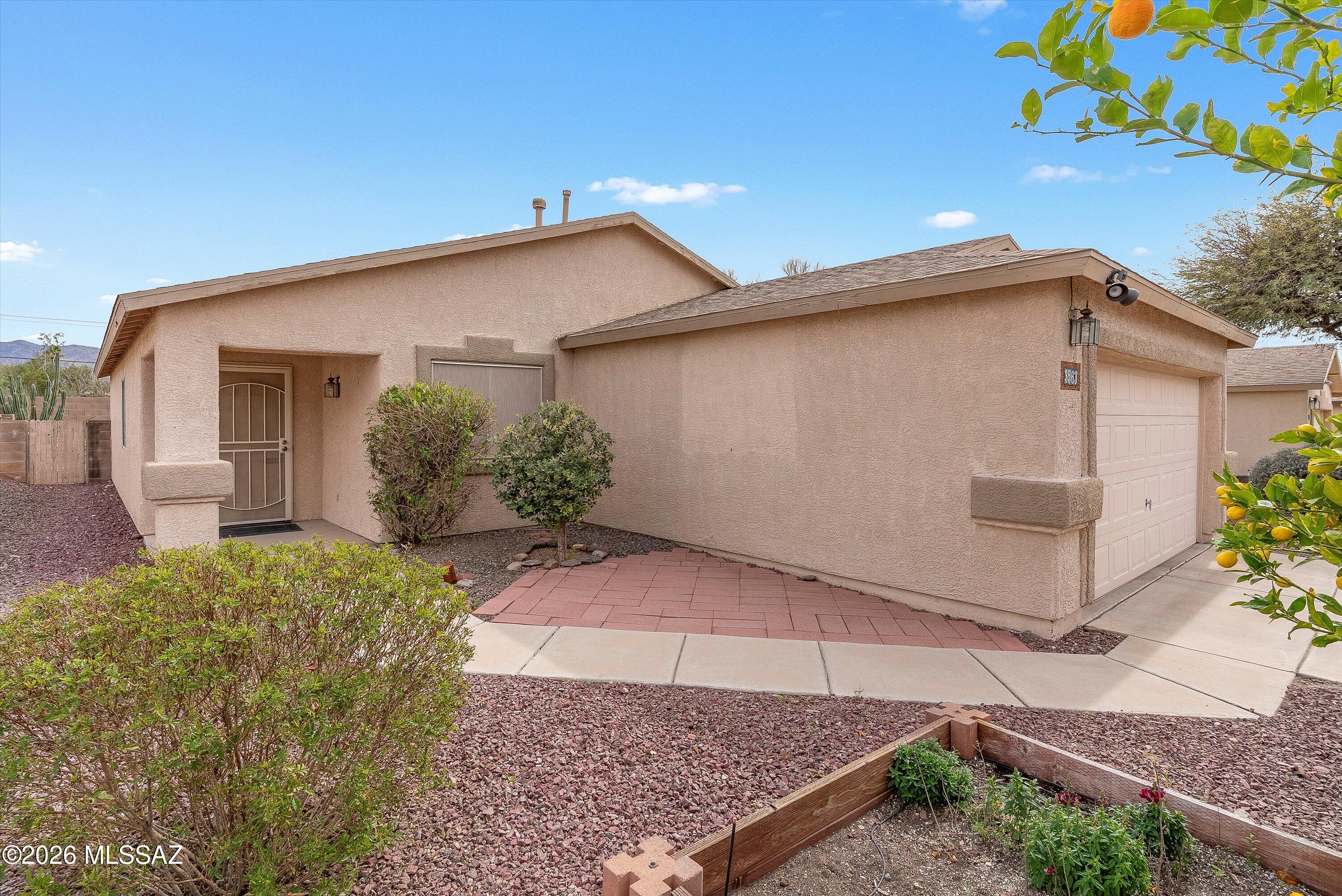Move-in ready 3BED/2BATH Eastside home waiting for you! Thoughtfully maintained and offering a functional layout, this home features a spacious living room and a generously sized owner's suite. All appliances convey, making your move even easier. The backyard is beautifully landscaped with pavers and desert-friendly plants, including a cereus cactus and a pineapple guava tree, while the front patio has pavers and  plenty of room for a bistro table to enjoy the evening sunsets plus it showcases a mature lemon tree and a beautiful chaste tree that blooms purple in the summer. Home is plumbed for 220 voltage for hot tub use. Don't miss out on this Eastside gem!