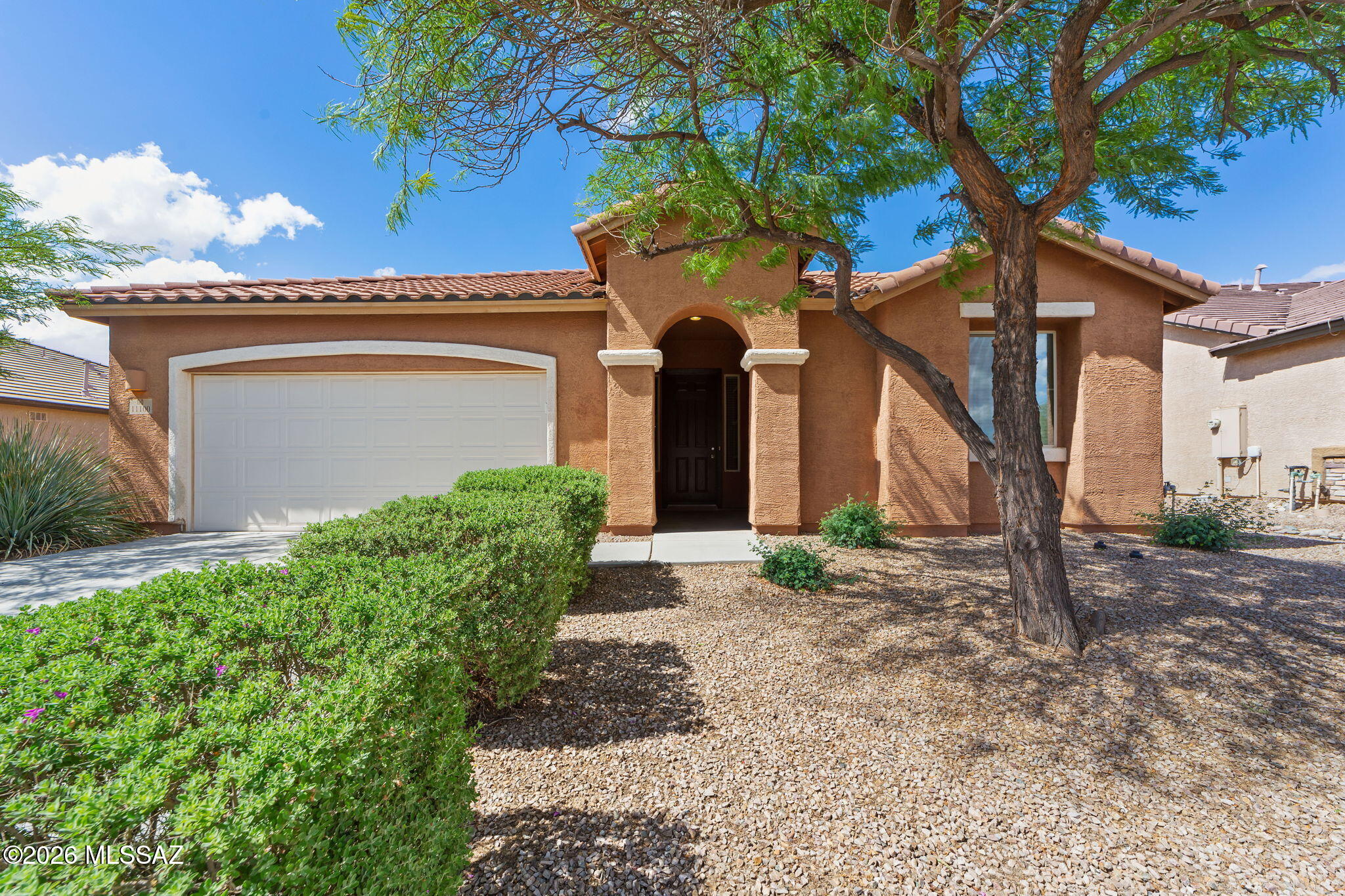 Built on a quiet cul-de-sac in the highly desirable San Lucas neighborhood, this beautiful Richmond American home offers impressive curb appeal with established trees and a tastefully landscaped front yard. The 1,750 sqft interior features an extended-width hallway leading into an open Great Room and dining area, making it an ideal space for entertaining. The kitchen is equipped with stainless steel appliances, an island with a breakfast bar, a large walk-in pantry, and ample cabinet space. There is a powder bathroom in the hall for your convenience. The split floor plan includes an owner's suite with an ensuite bathroom featuring an oversized shower, executive-height double vanities, and a spacious walk-in closet. Additionally, there are two guest bedrooms with sliding closets, a full guest bathroom, and a large laundry room with significant storage space. The home is finished with 2" faux wood blinds throughout.
Outside, the low-maintenance rear yard includes a covered patio, stone retaining wall, and an access gate. The property is conveniently located near schools, community parks, trails, and is within five minutes of I-10.
This home is move-in ready, offering all the benefits of a new build without the wait. Please contact me to schedule an appointment to see this property today.