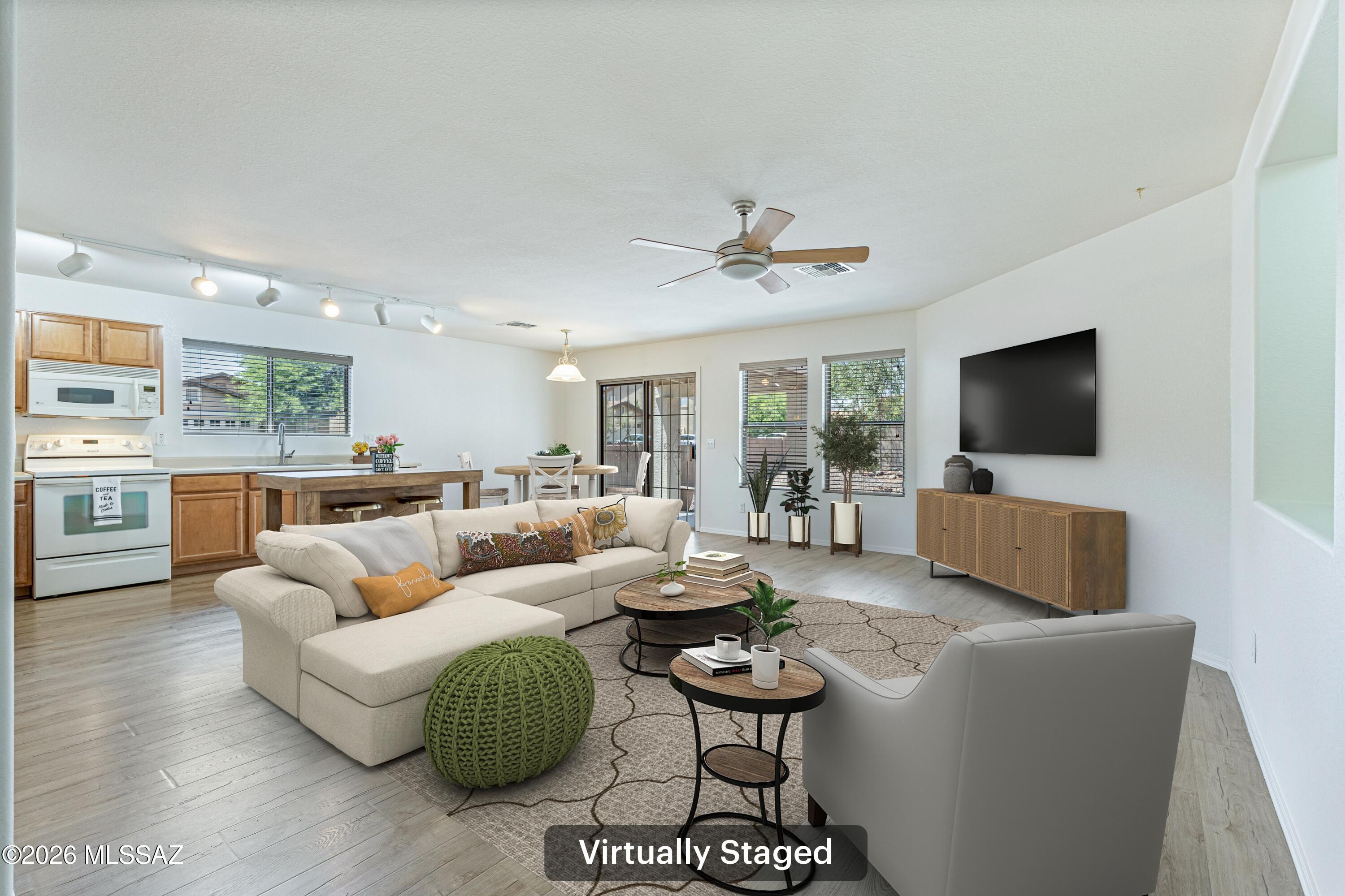 Move-in ready and PRICED TO SELL! Located on a cul-de-sac on a corner lot in the heart of Rancho Vistoso. ROOF REPLACED DEC 2025. HVAC FROM 2021. WATER HEATER & FRESH INTERIOR PAINT 2026. Bright, open and airy. Multiple living spaces. Updated laminate flooring throughout. Nice sized primary bedroom with ensuite with dual sinks and a walk-in shower. Two car garage, with the garage finished in 2026. Covered Patio. Easy Care Landscaping. Two well sized guest rooms. Charming home ready for its new owner!