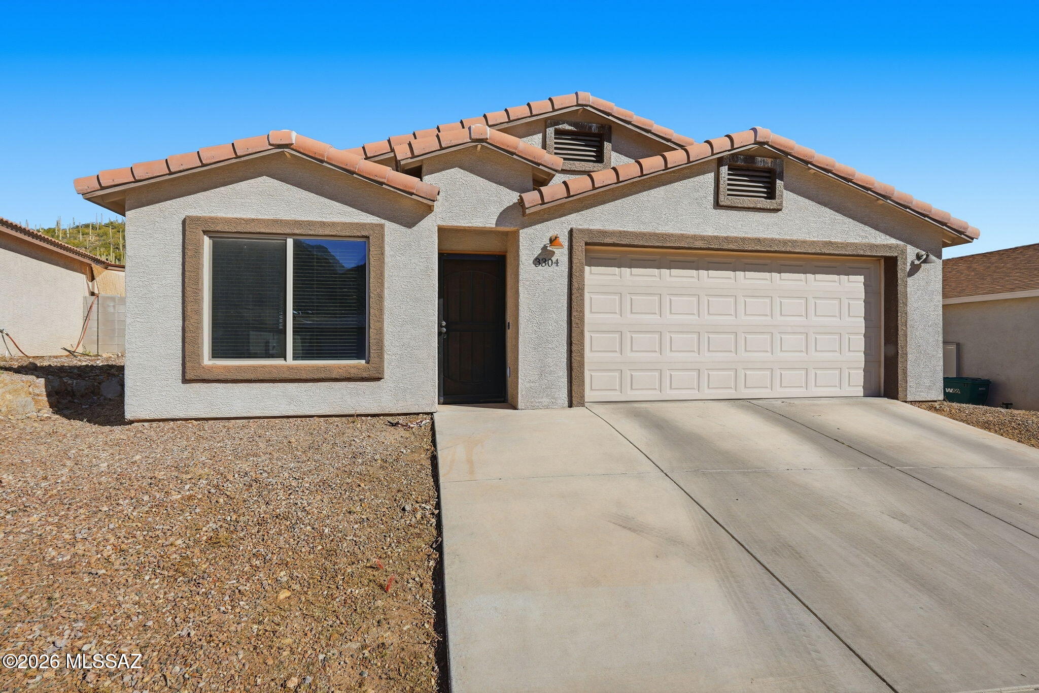Seller is offering 1% concessions towards buyer's closing costs.  Seller will counter or accept offers between $345,000-$355,000. Welcome to 3304 W Athenee Ct. a beautifully designed contemporary home located in Southwest Tucson, where modern comfort meets breathtaking desert surroundings. This 4-bedroom, 2-bathroom residence offers a thoughtfully planned layout, quality construction, and stylish finishes.  Enhanced by natural light.  Durable wood-look ceramic tile flooring throughout the main living areas, creating both elegance and easy maintenance. The spacious living and dining areas flow seamlessly, ideal for everyday living and entertaining.  This home is built with quality and efficiency in mind, featuring R-38 ceiling insulation for enhanced energy performance. This property is located just 5 minutes to retailers, popular restaurants, and everyday conveniences.