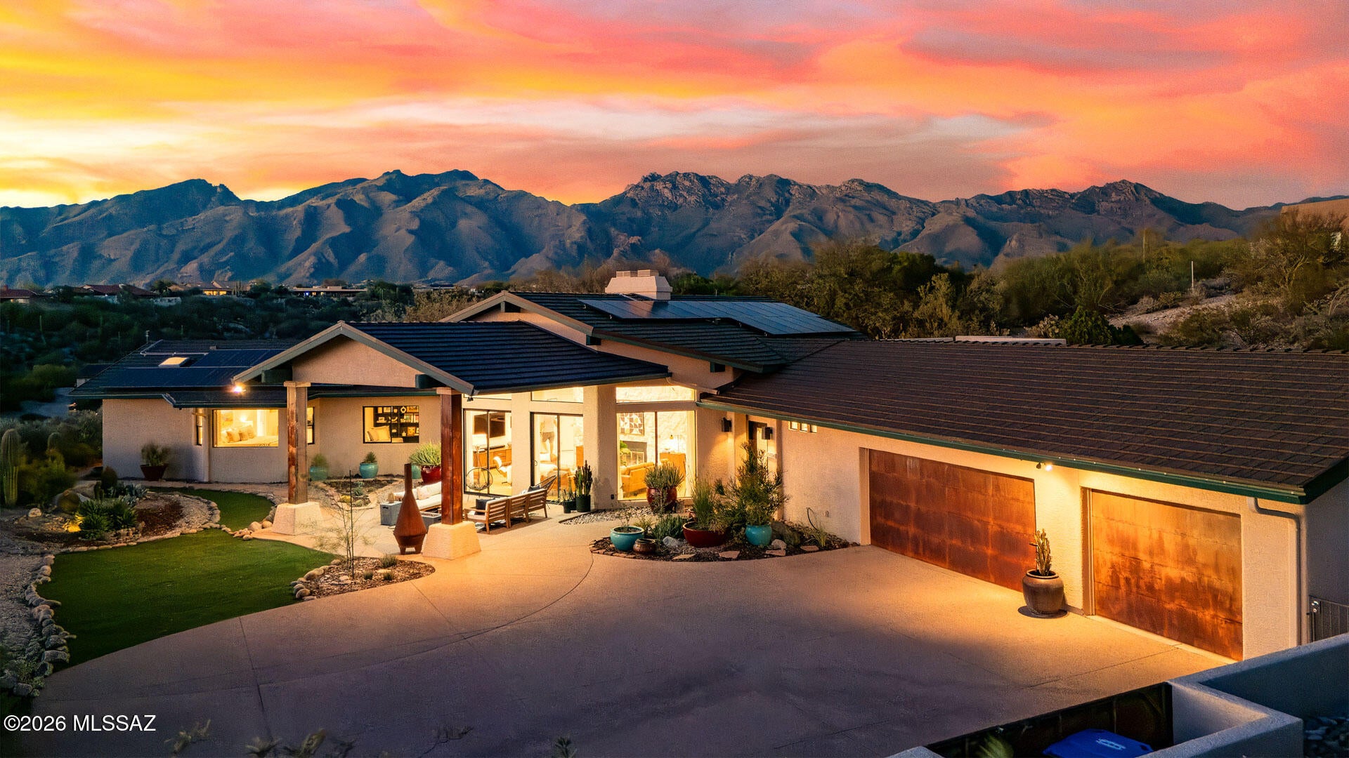 CONTEMPORARY STYLE WITH PANORAMIC VIEWS, REMODELED, AND READY TO MOVE IN! Enjoy fabulous, unobstructed city and mountain views from this beautifully updated 2,855 sq. ft. contemporary residence, where modern desert design meets comfort and functionality. Featuring 3 bedrooms, 3 bathrooms, a 3-car garage, and owned solar, this exceptional home showcases extensive updates and quality finishes throughout. The remodeled kitchen is a standout, featuring quartz countertops and backsplash, custom soft-close cabinetry, a stainless steel sink, reverse osmosis water filtration, and an impressive collection of premium appliances, including a Forno French-door refrigerator system and KitchenAid appliances. Recessed LED lighting enhances the clean, contemporary aesthetic. All bathrooms have been beautifully renovated with new tile, floating cabinetry, quartz countertops, sinks, and fixtures. The spacious primary suite offers two walk-in closets and a thoughtfully reconfigured bathroom with a large soaking tub, a custom shower system featuring dual shower heads and a hand shower, illuminated anti-fog mirrors, and elegant glass accents. Major system upgrades include a new HVAC system and solar inverter in 2026, plus a 250,000 BTU pool heater installed in 2025. The pool and spa have been replastered and feature new tile, creating an inviting setting for relaxation and outdoor enjoyment of sunset mountain views. The outdoor kitchen and rooftop deck are perfect for entertaining. With its extensive remodeling, contemporary style, premium finishes, and spectacular unobstructed city views, this move-in-ready residence offers an exceptional opportunity to enjoy modern Tucson living.