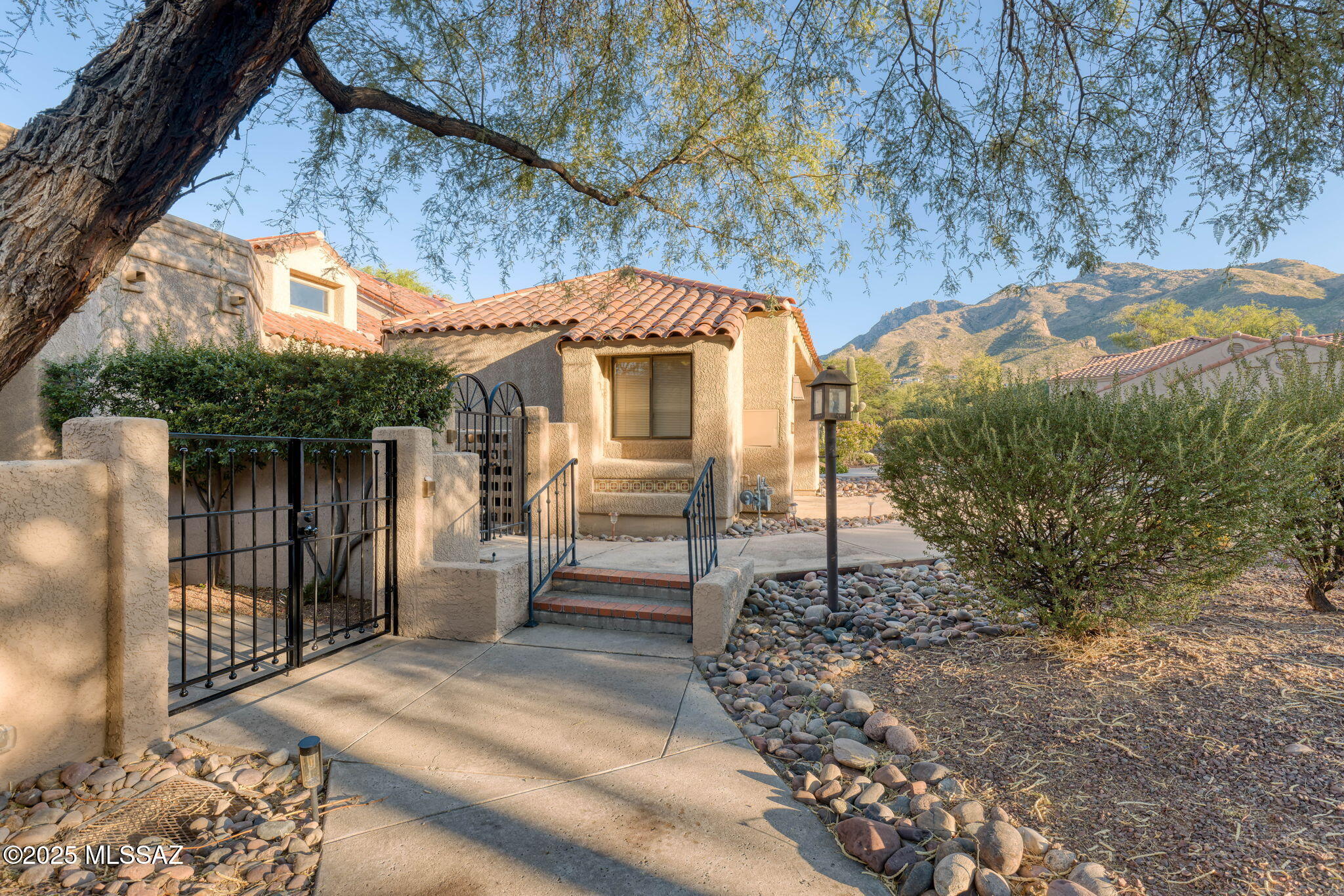 Updated golf Villa at entry-level price point in the prestigious gated community of Ventana Canyon. Quiet cul-de-sac location on the East side of the driving range offering sunset views. Features include: courtyard entry, open floor plan w/vaulted ceilings, 2BR & 2BA + office, 2 car garage, and private back patio w/ views of the driving range. Some of the fine updates (2023-2025) include: vinyl plank flooring, interior paint, lighting, and door hardware throughout as well as recessed electric fireplace in great room, window blinds, kitchen appliances, and some updating to Primary & guest bathrooms. Community Pool & Spa for villa owners only. Close to golf, tennis, pickleball, pools, gym, and dining at the Ventana Canyon Country Club. Enjoy easy resort living in this ''lock and go'' villa!