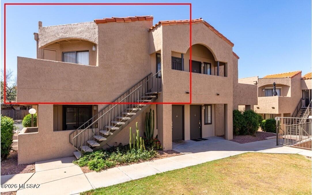 Top floor 1-bed/1-bath gated move-in ready condo in a perfect spot (Cat Tran/bus/supermarket within walking distance, Mountain Ave bike path and University of Arizona/Banner around 1.5 miles). Inside this open-concept retreat, you'll find vaulted ceilings with natural light, highlighting modern wood-look floors and kitchen with stainless steel appliances. The bedroom has newer plush carpet and closet, while the private balcony from this interior upstairs unit provides a quiet spot with magnificent mountain views. This gated community features an impressive array of amenities--including a pool, spa, fitness, clubhouse, and basketball court--with an HOA that covers water, trash, exterior maintenance and roof (replaced in 2025).  

Furnishings available to sell separately.