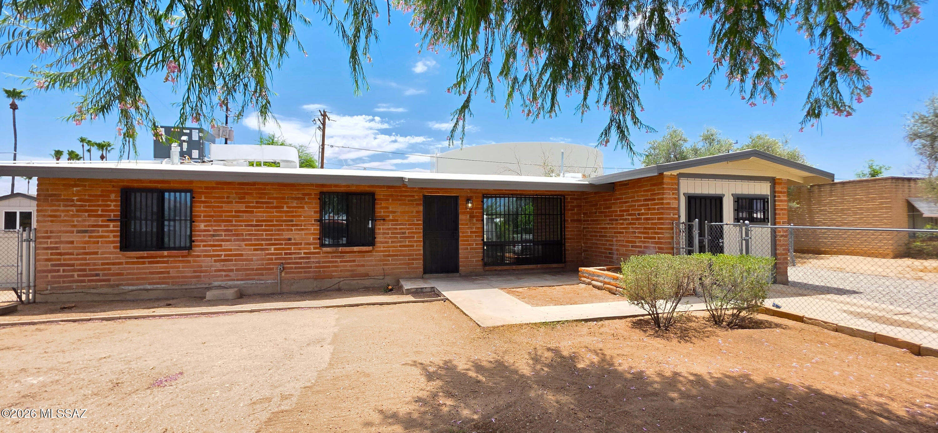 Updated Central Tucson Gem! This move-in ready single-family home blends modern style with unbeatable convenience.  The bright interior features brand-new luxury vinyl plank flooring in high-traffic areas, plush new carpet in the bedrooms, and fresh paint inside and out. The upgraded kitchen shines with refinished cabinets and gleaming stainless steel appliances. Both bathrooms are beautifully refreshed with new vanities, contemporary light fixtures, and modern plumbing hardware. Nestled in a highly accessible central neighborhood, you are just minutes from premium shopping, dining, parks, and major commuter routes. Perfect for first-time buyers, downsizers, or investors looking for a turn-key property. Schedule your tour today!
