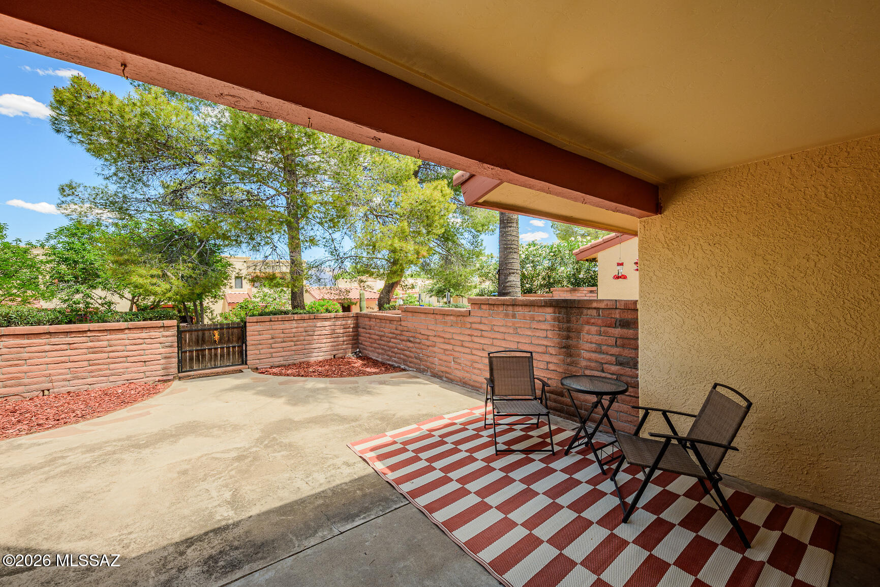 Wonderful 3 bed, 3 bath, 1583 sq. ft. townhouse with backyard/ patio space and beautiful mountain views make this a rare find. Ask about assumable loan 4.5%! Downstairs bedroom can be used as an office/den/library or guest quarters with it's own full bath. Two bedrooms upstairs are nice size with their own private baths. Kitchen has newer appliances, lots of cabinet and counter space and is open to the family room and dining area. Sliding glass door leads out to enclosed North facing yard. Home exterior recently painted &Amazing Community pool/rec center redone! Laundry room is off the patio area. Two covered parking spaces in front for easy access. Guest parking space at end of block. Nice location