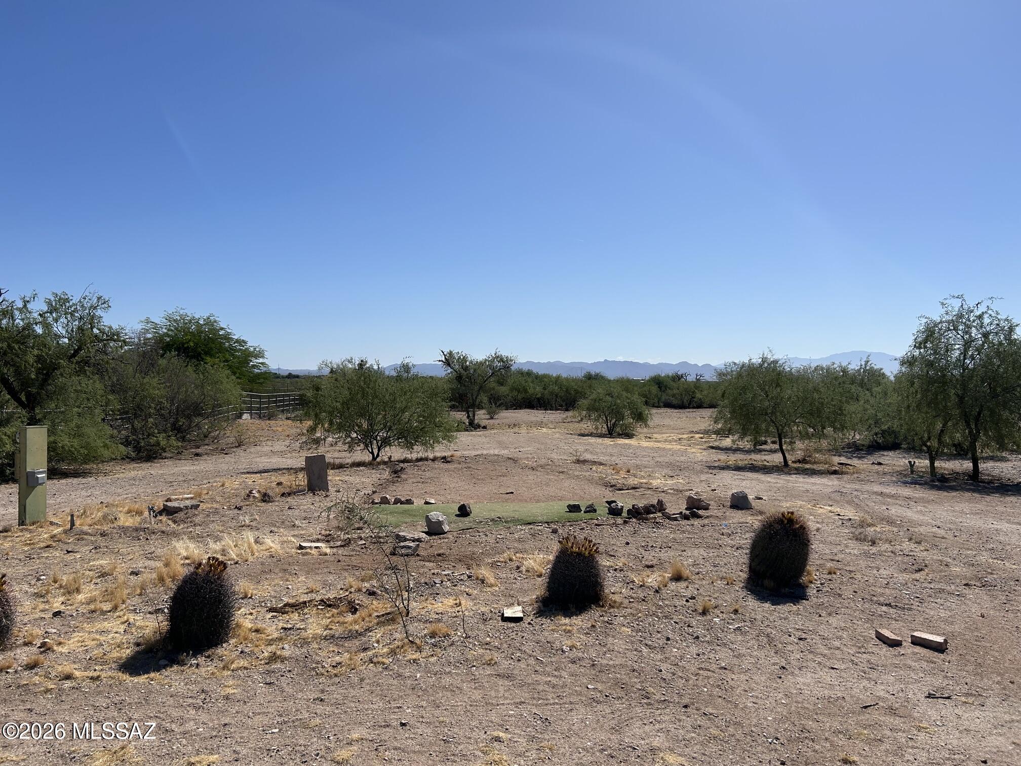 Rare opportunity to own a fully improved 1.17-acre homesite in Marana, Arizona. This exceptional horse property offers never ending, unobstructed views of the Catalina Mountains to the east and backs to a large city of Tucson vacant parcel, providing added privacy and open space with no immediate rear neighbors. The property is fully fenced and features a new double-entry gate, making access easy for vehicles, trailers, RVs, and equestrian use. Major improvements are already in place, including a completed septic system, water service, and electric on site-saving significant time and expanse for your future build.