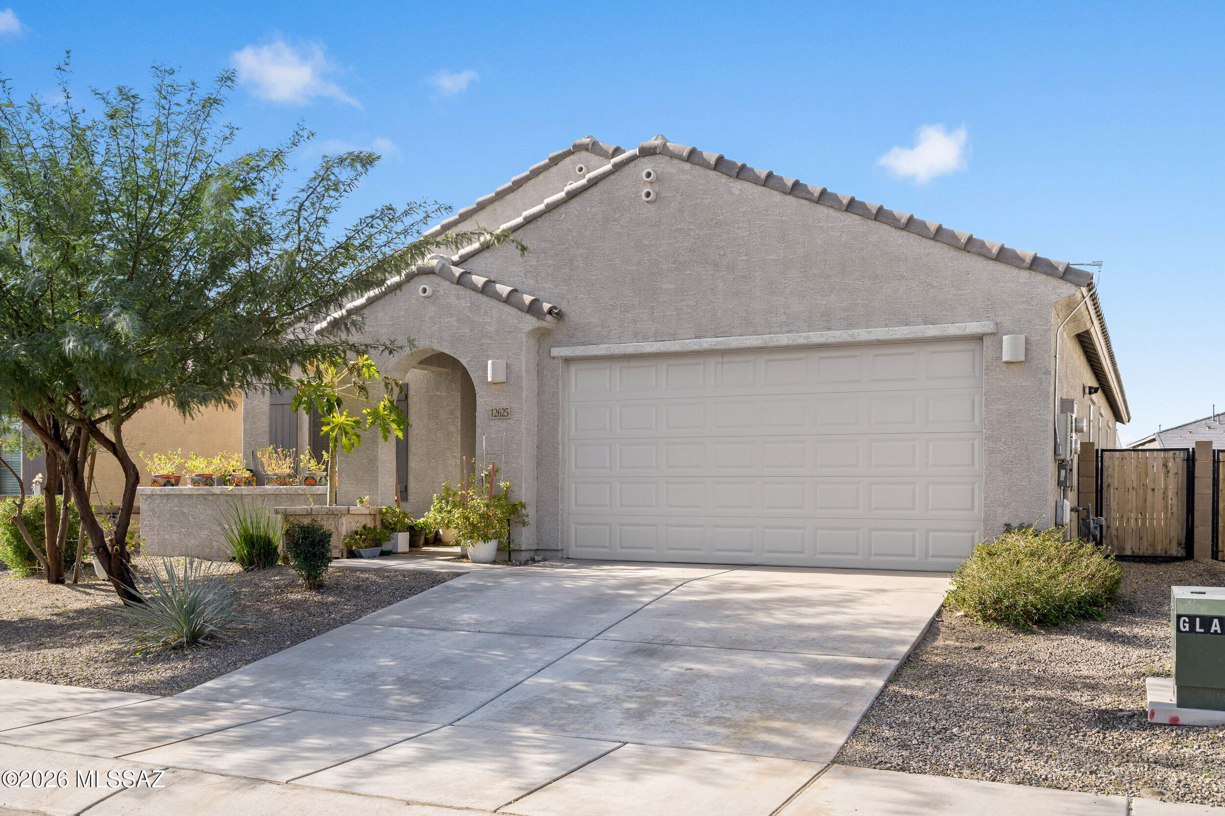 Move-in ready and energy-efficient, this beautifully maintained four-bedroom w/ DEN & two-bath home with owned solar system is located in the highly desirable Gladden Farms community. The light-filled open-concept layout features a modern gray palette, ceramic tile in high-traffic areas, and carpeted living spaces for added comfort. The kitchen offers granite countertops, espresso cabinetry, stainless-steel appliances, a large island with breakfast bar, and pantry. The owner's suite includes dual sinks, a walk-in closet, and abundant natural light. Enjoy a split floor plan, versatile den, spacious backyard with no rear neighbors, decorative view fencing, storage shed, washer and dryer, lower electric bills, nearby community park, playground, and access to a new K-8 school.