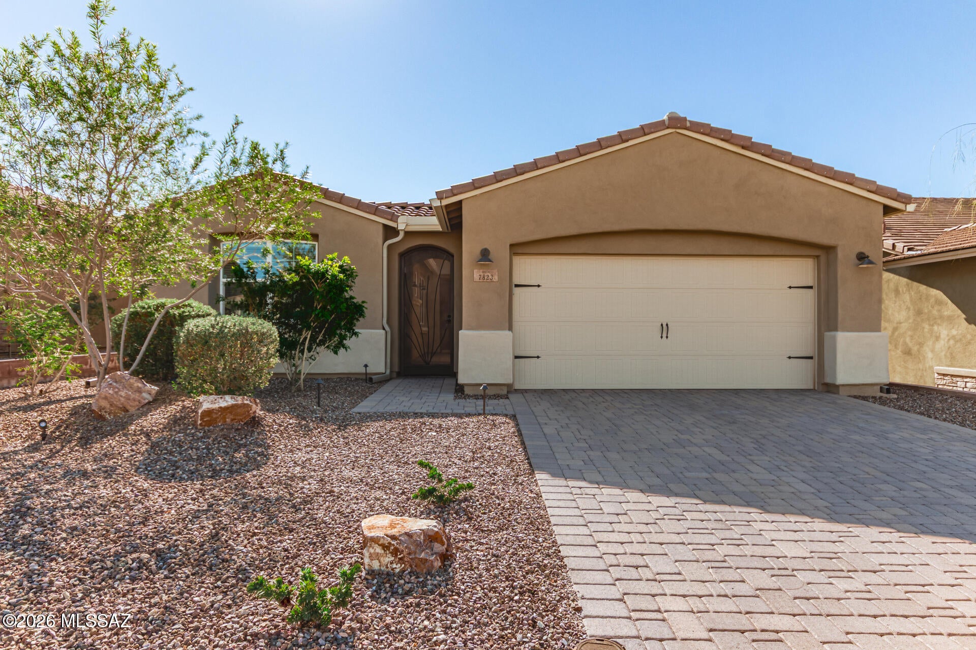 Nestled within the desirable Blue Agave enclave at Dove Mountain, this exceptional residence offers a perfect blend of comfort, style, and Arizona-inspired living. Encompassing 1,810 square feet, the thoughtfully designed Peralta floor plan features 2 bedrooms, 2 bathrooms, and a flexible bonus room ideal for a home office, den, or guest space. Beautiful 8-foot doors paired with soaring 9-foot ceilings create an elevated sense of space and refinement throughout. The gourmet kitchen is a standout, showcasing elegant cabinetry, upscale finishes, & a large breakfast bar with generous seating--perfect for casual dining and entertaining. The private primary suite serves as a peaceful sanctuary, enhanced by serene views and a luxurious bath featuring a tiled walk-in shower & spa-style details.